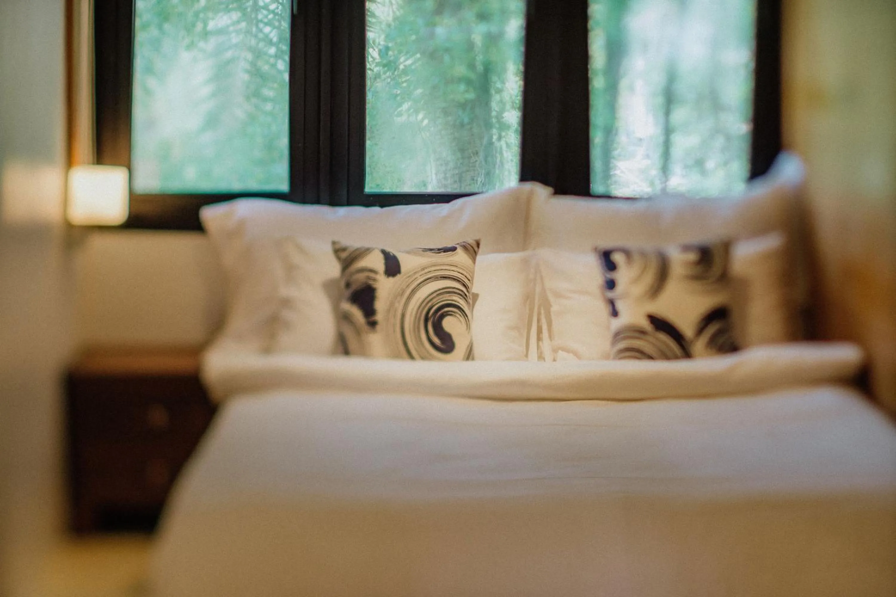 Bed in The Anda Mani Khaolak Beachfront Villas - Adult only