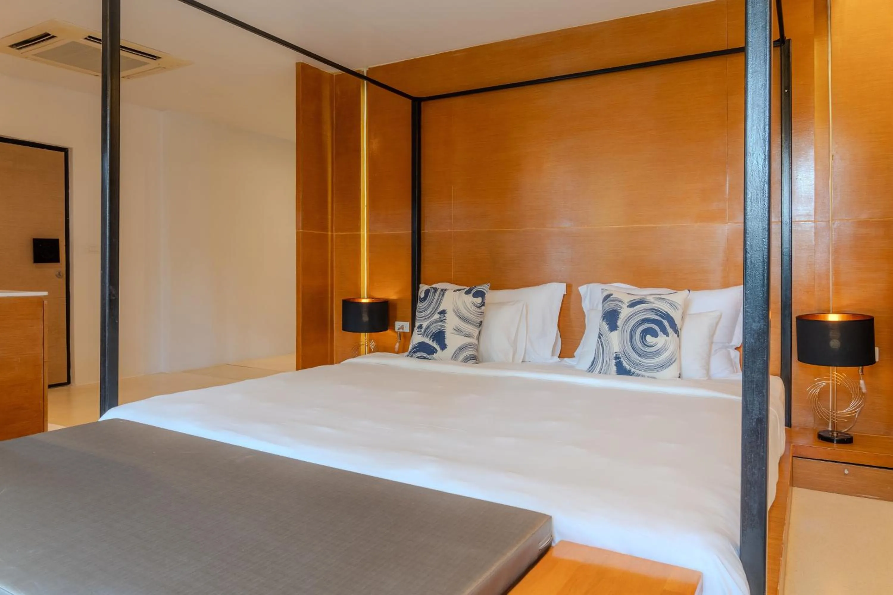 Bed in The Anda Mani Khaolak Beachfront Villas - Adult only