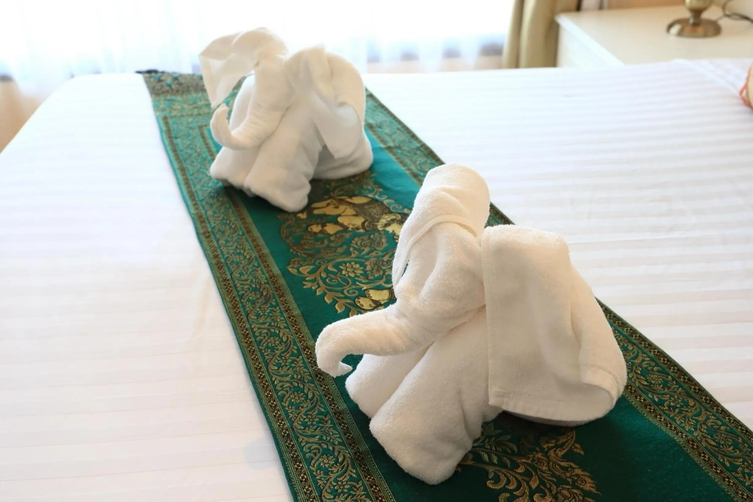 Bed in Royal Nakhara Hotel and Convention Centre