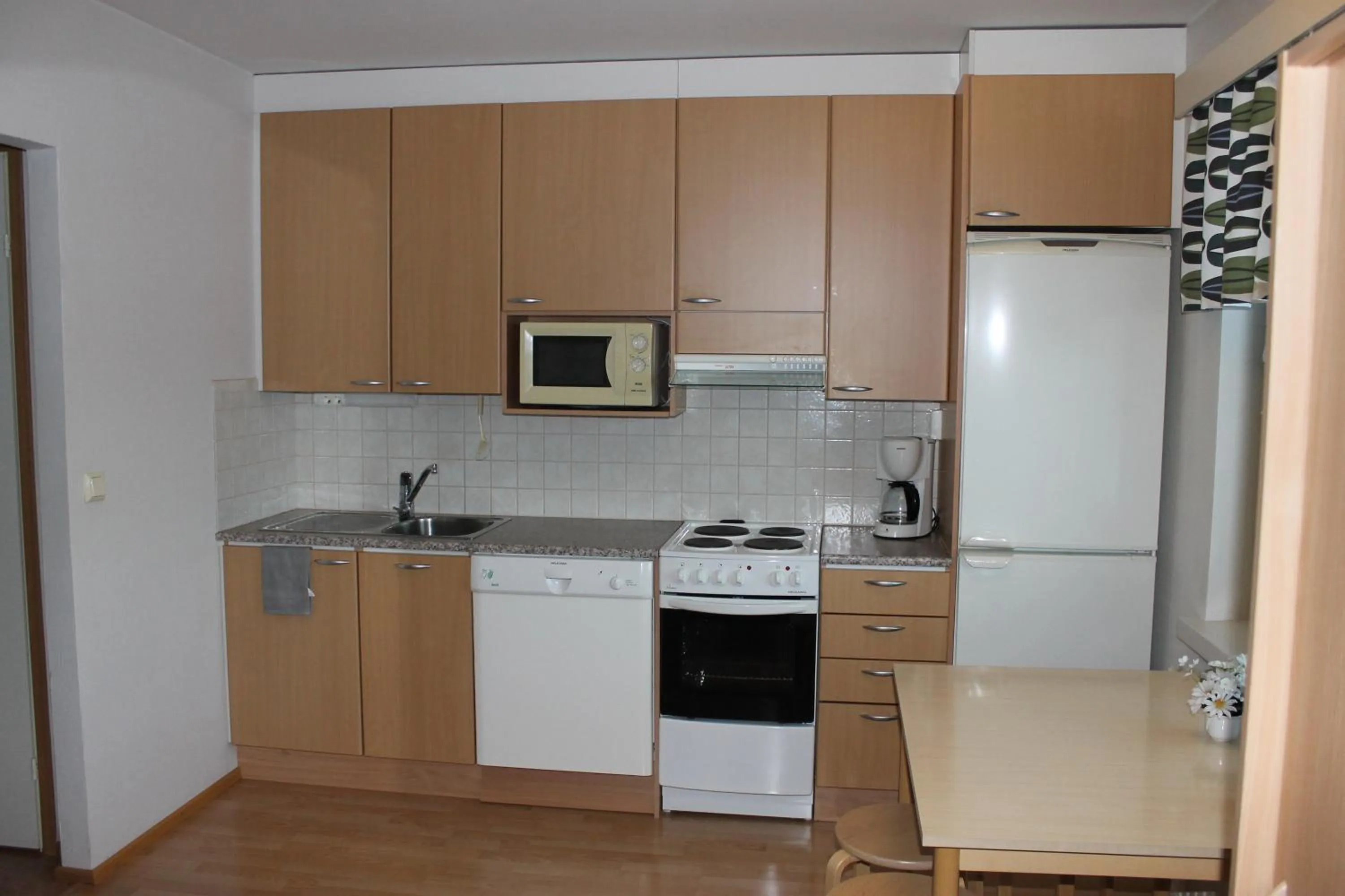 Kitchen or kitchenette in Motelli Jätkänkolo