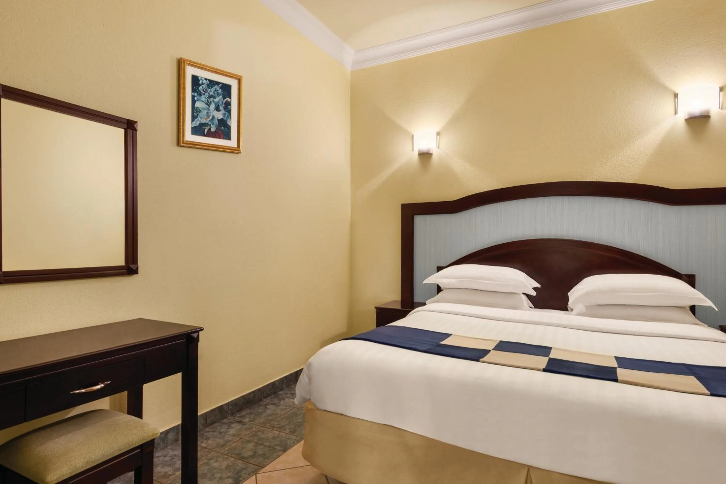 Bed in Howard Johnson Dammam Hotel