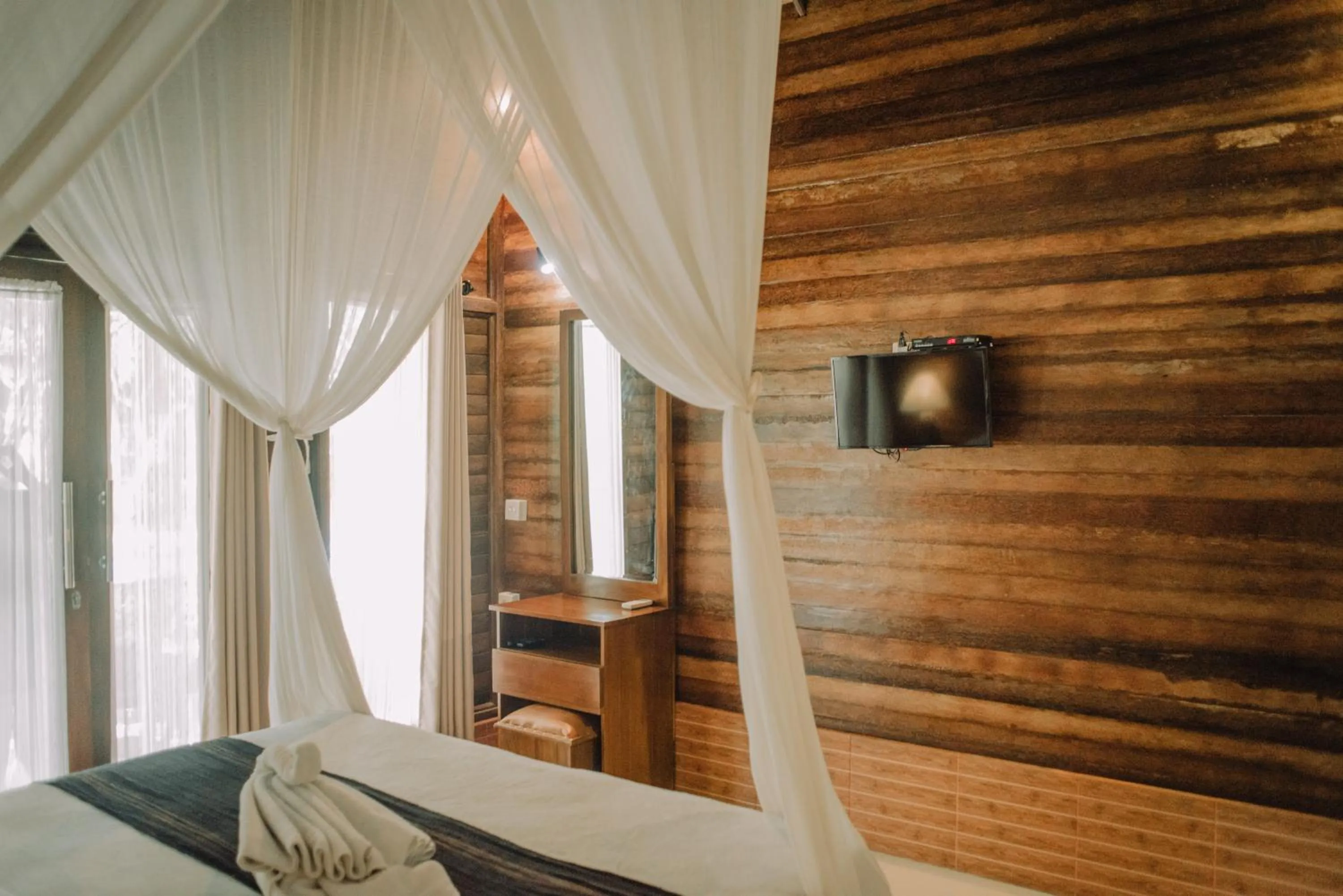 Bed in Mertasari Bungalows