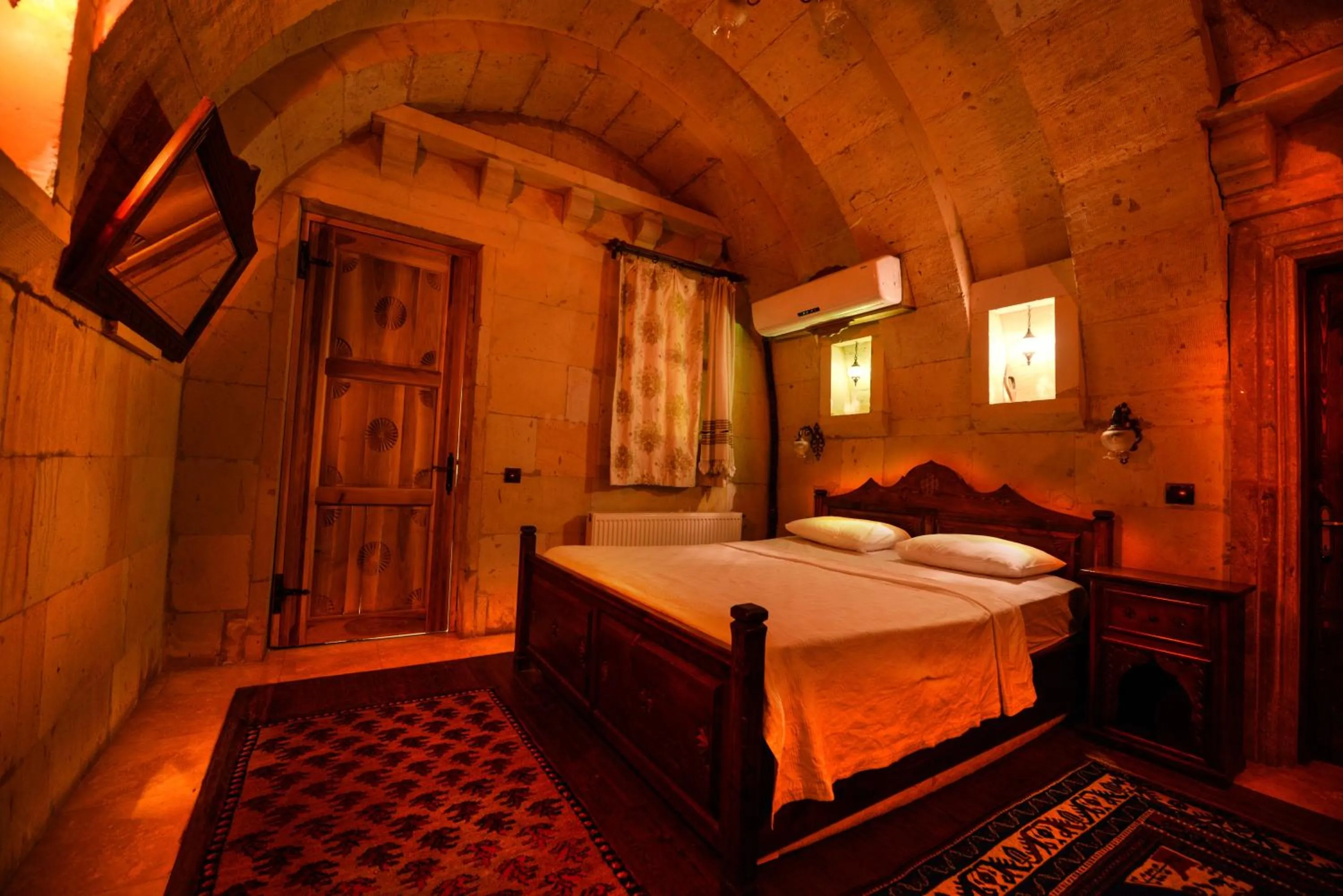 Bed in Vineyard Cave Hotel