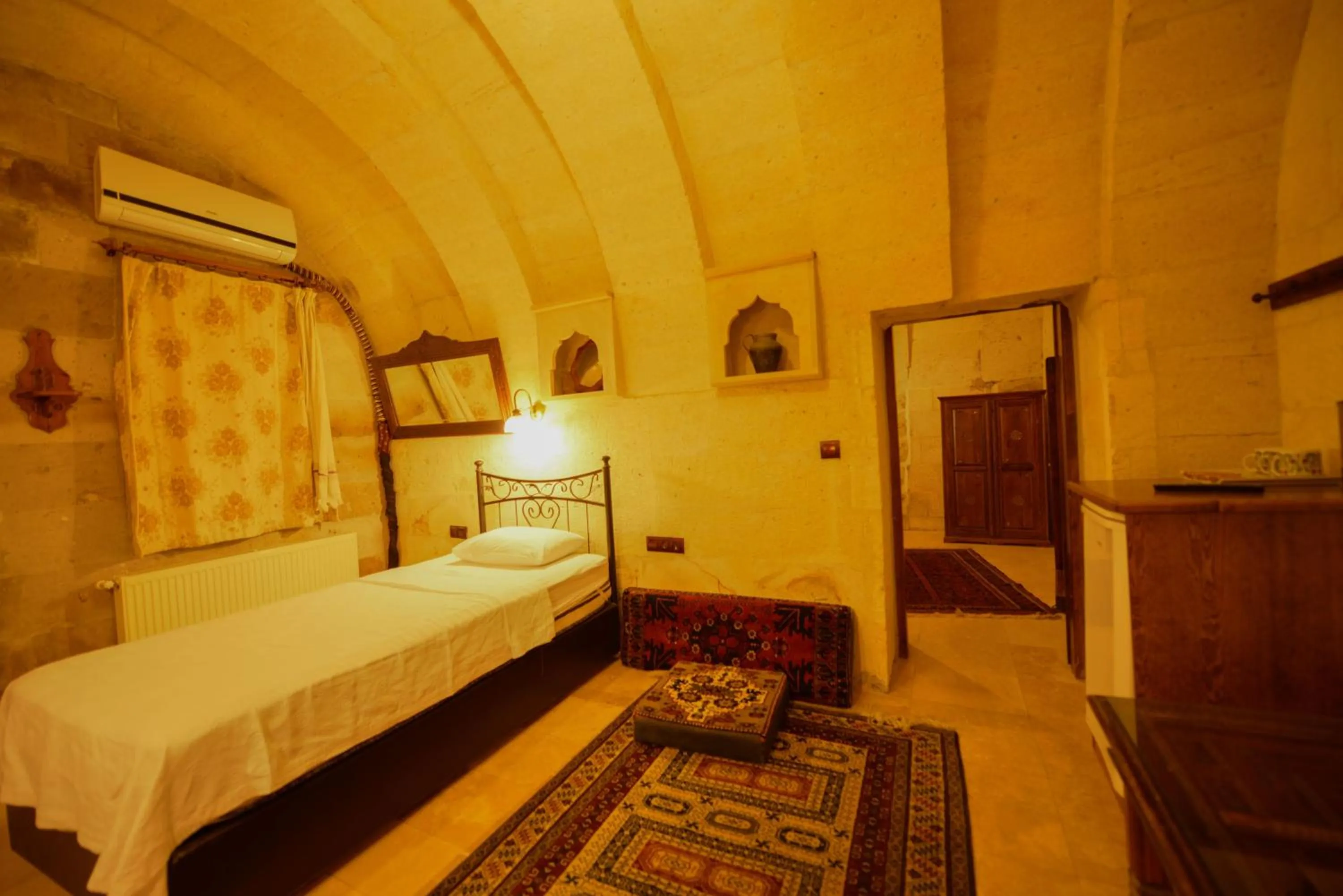 Bed in Vineyard Cave Hotel