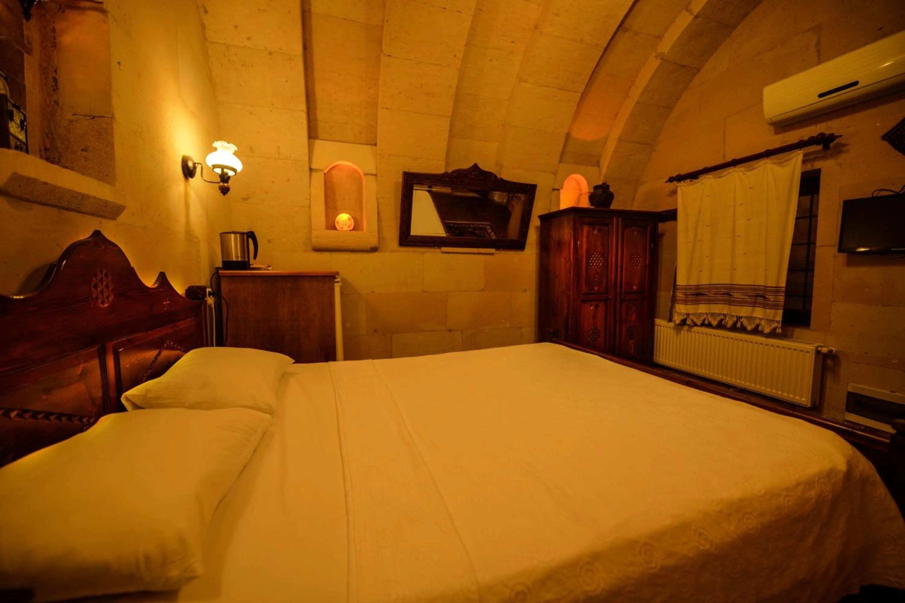 Bed in Vineyard Cave Hotel