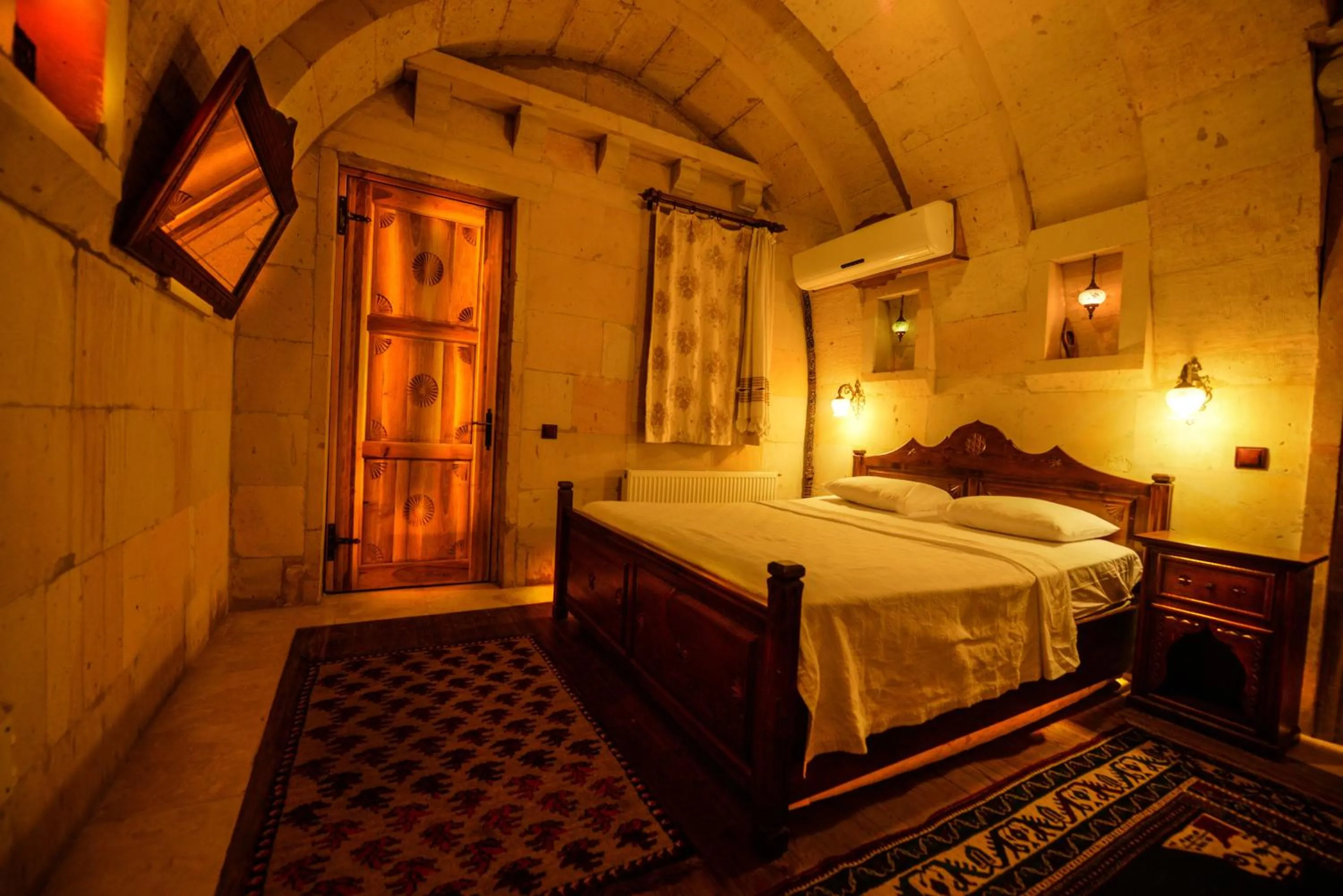 Bed in Vineyard Cave Hotel