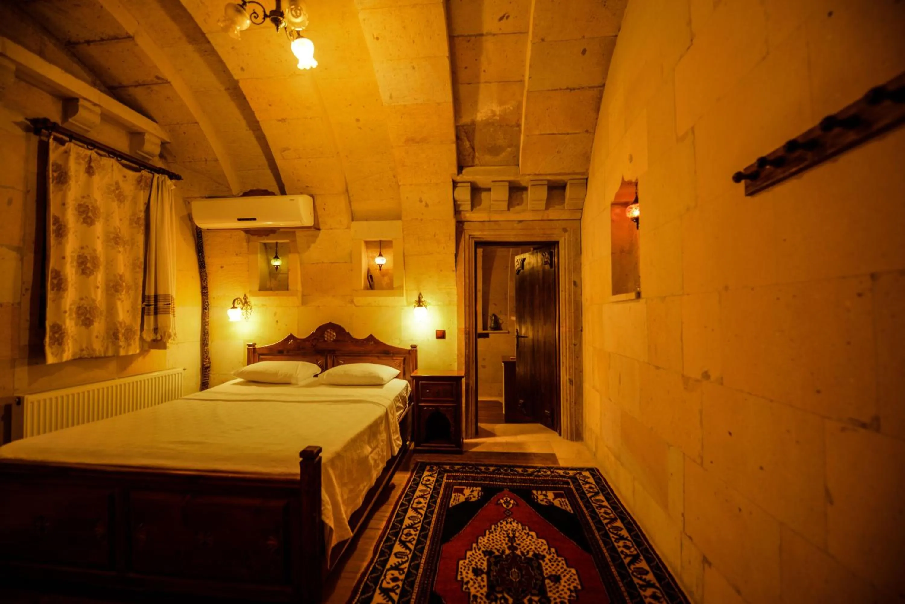 Bed in Vineyard Cave Hotel