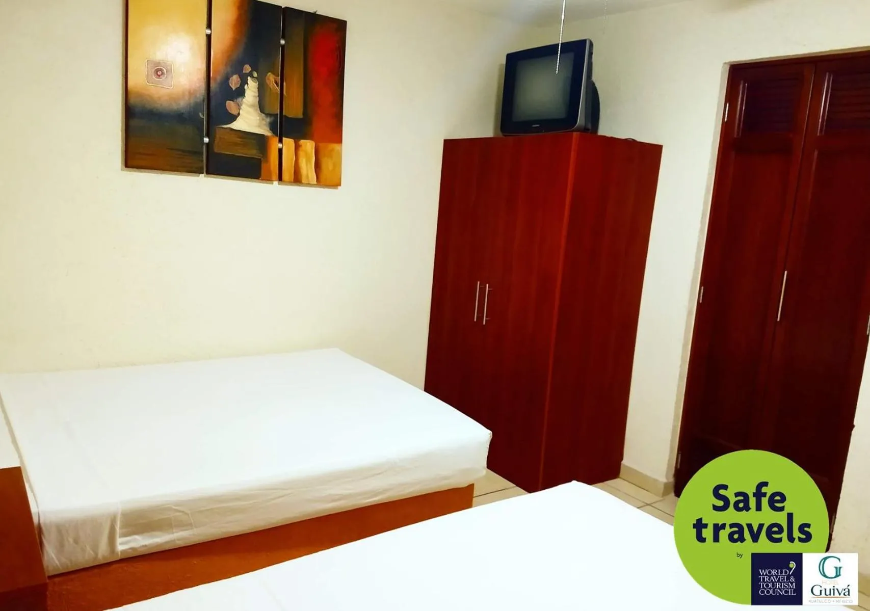 Bed in Hotel Guivá Huatulco