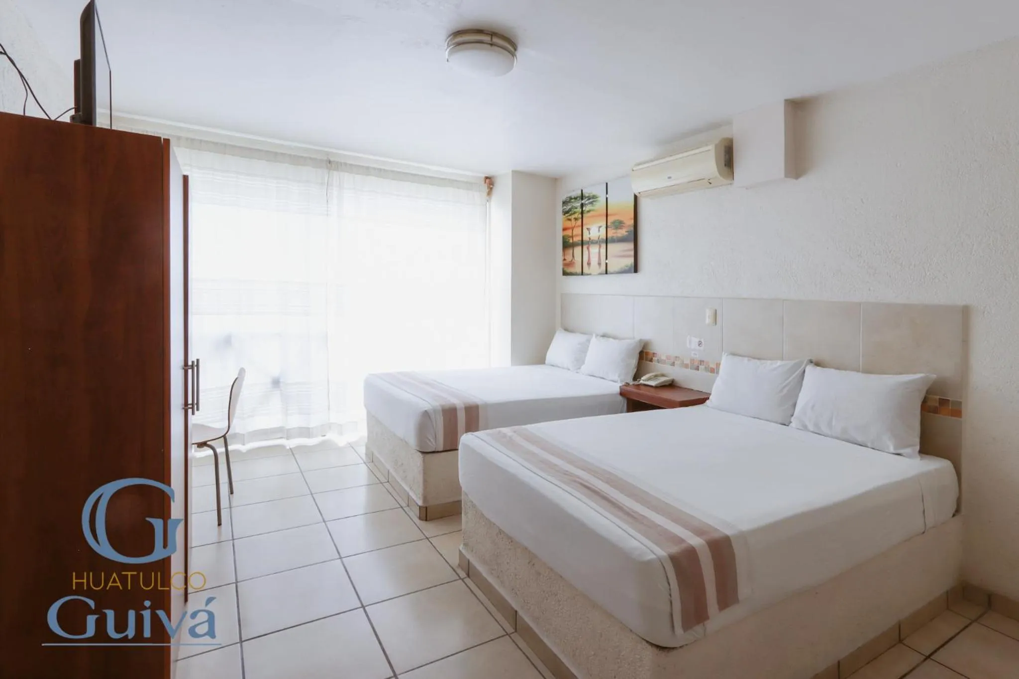 Property building, Bed in Hotel Guivá Huatulco