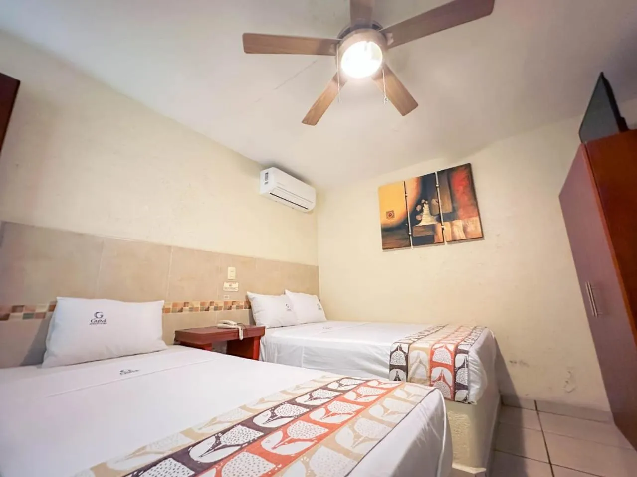 Bed in Hotel Guivá Huatulco