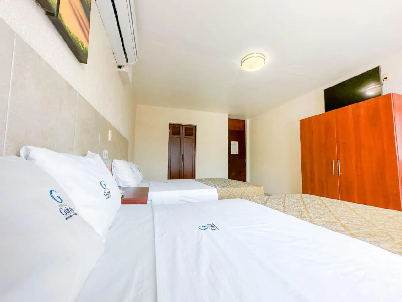 Bed in Hotel Guivá Huatulco