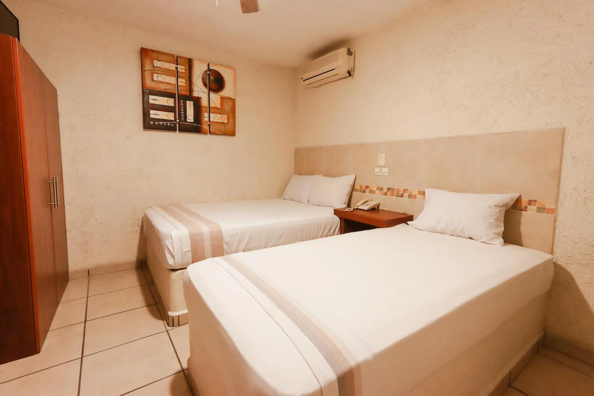 Bed in Hotel Guivá Huatulco