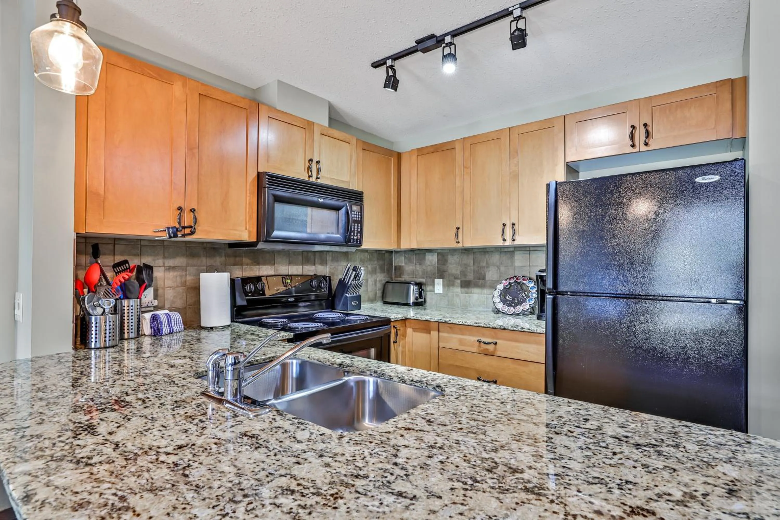 kitchen in Inviting Rocky Mountain HOT TUB in Top Rated Condo managed by Little Sister Getaways