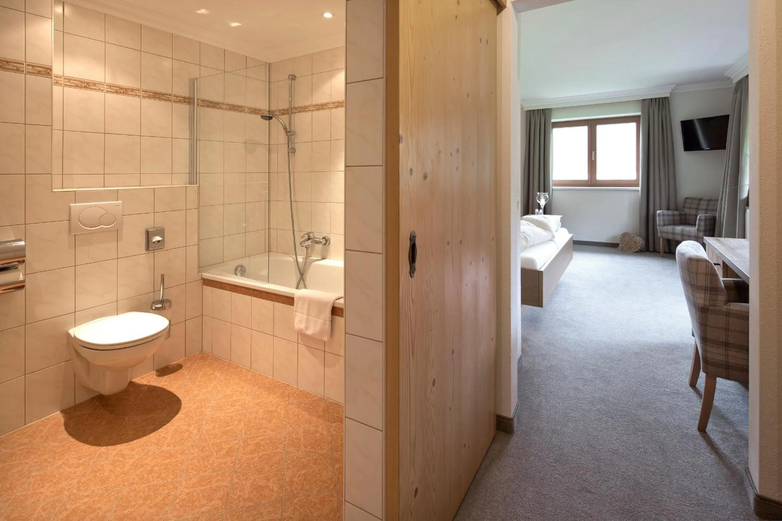 Bathroom, Bed in Hotel Bergland