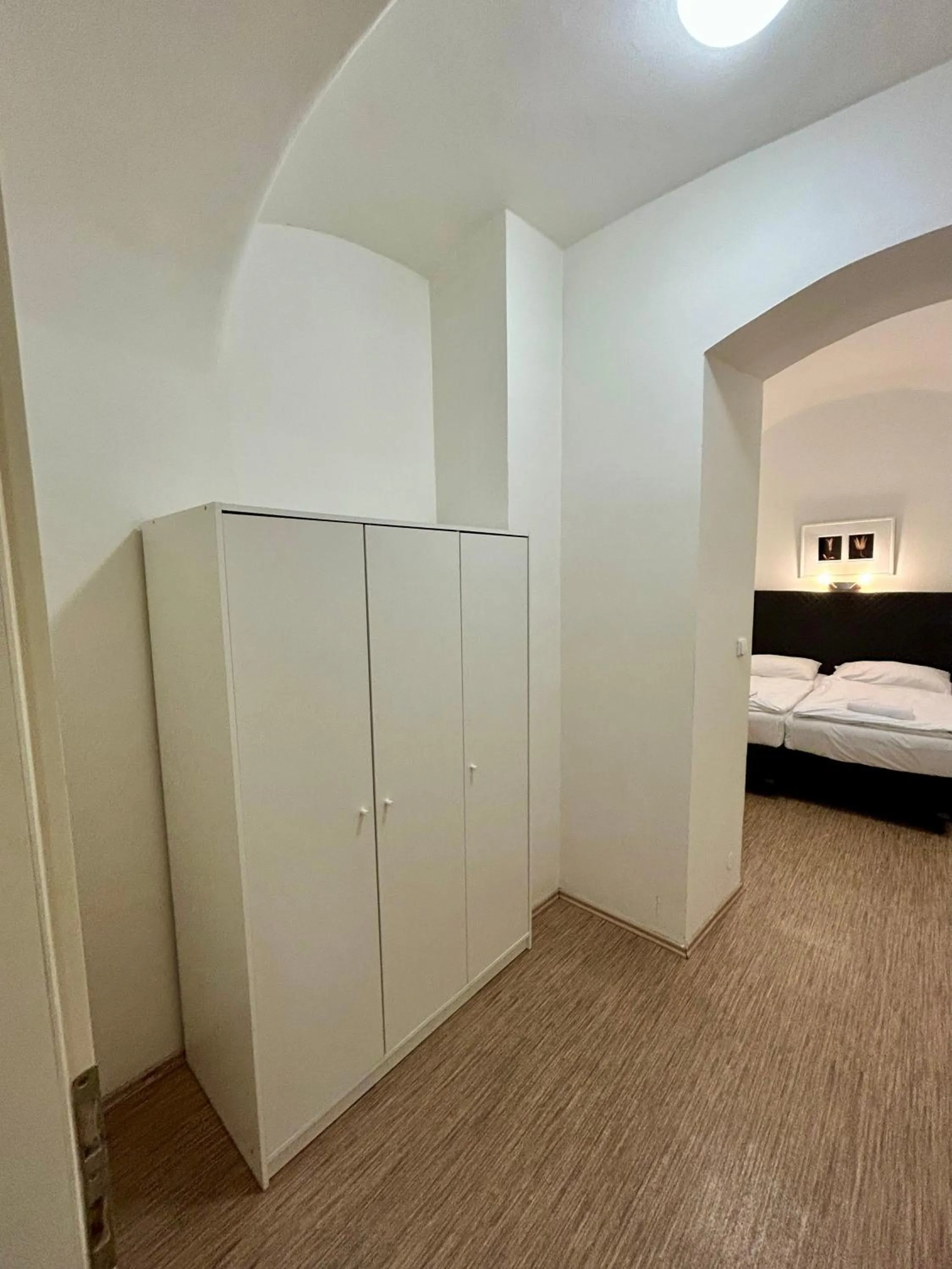 wardrobe, Bed in Prague Central Residence
