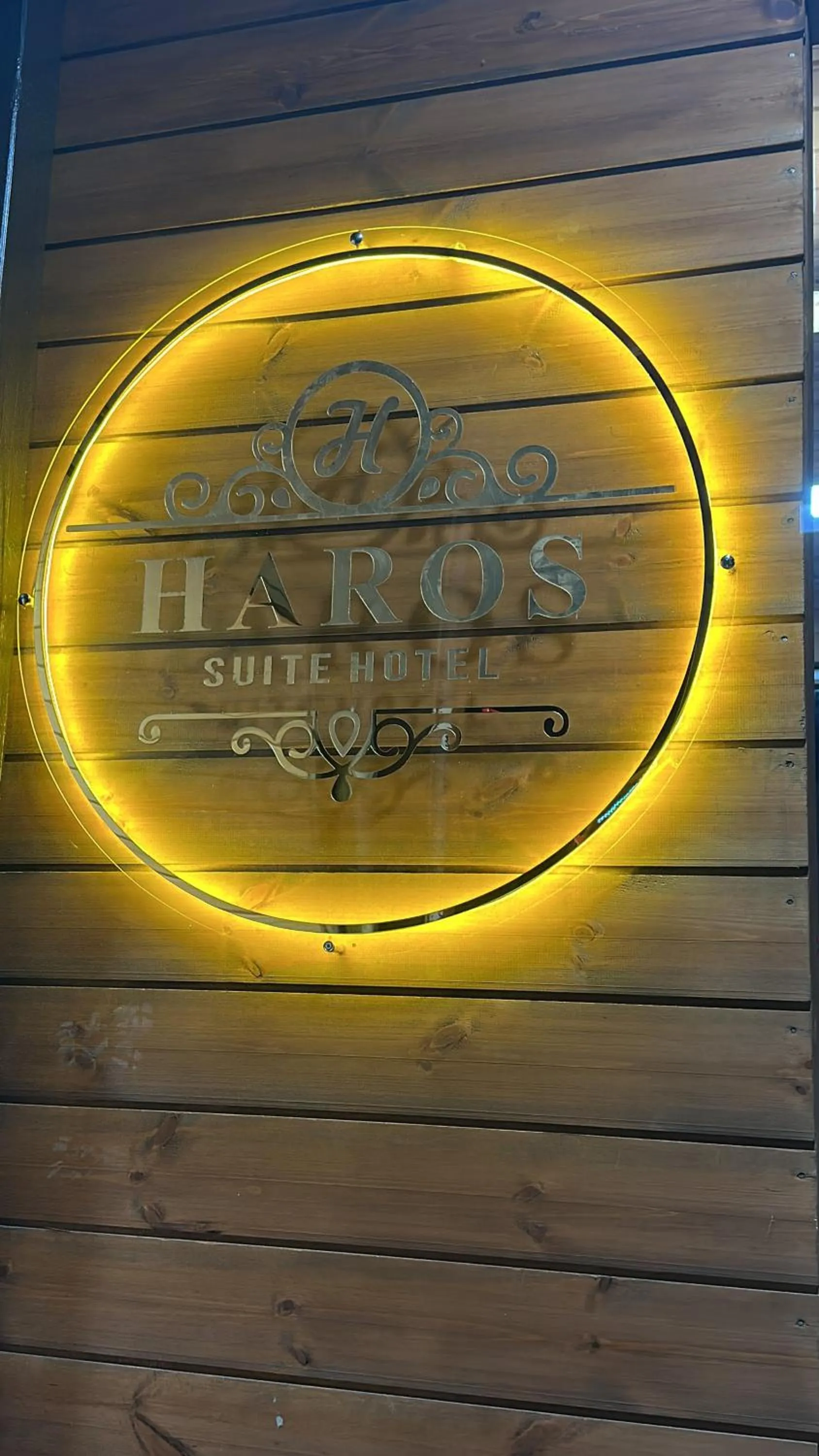 Property logo or sign in Haros Suite Hotel