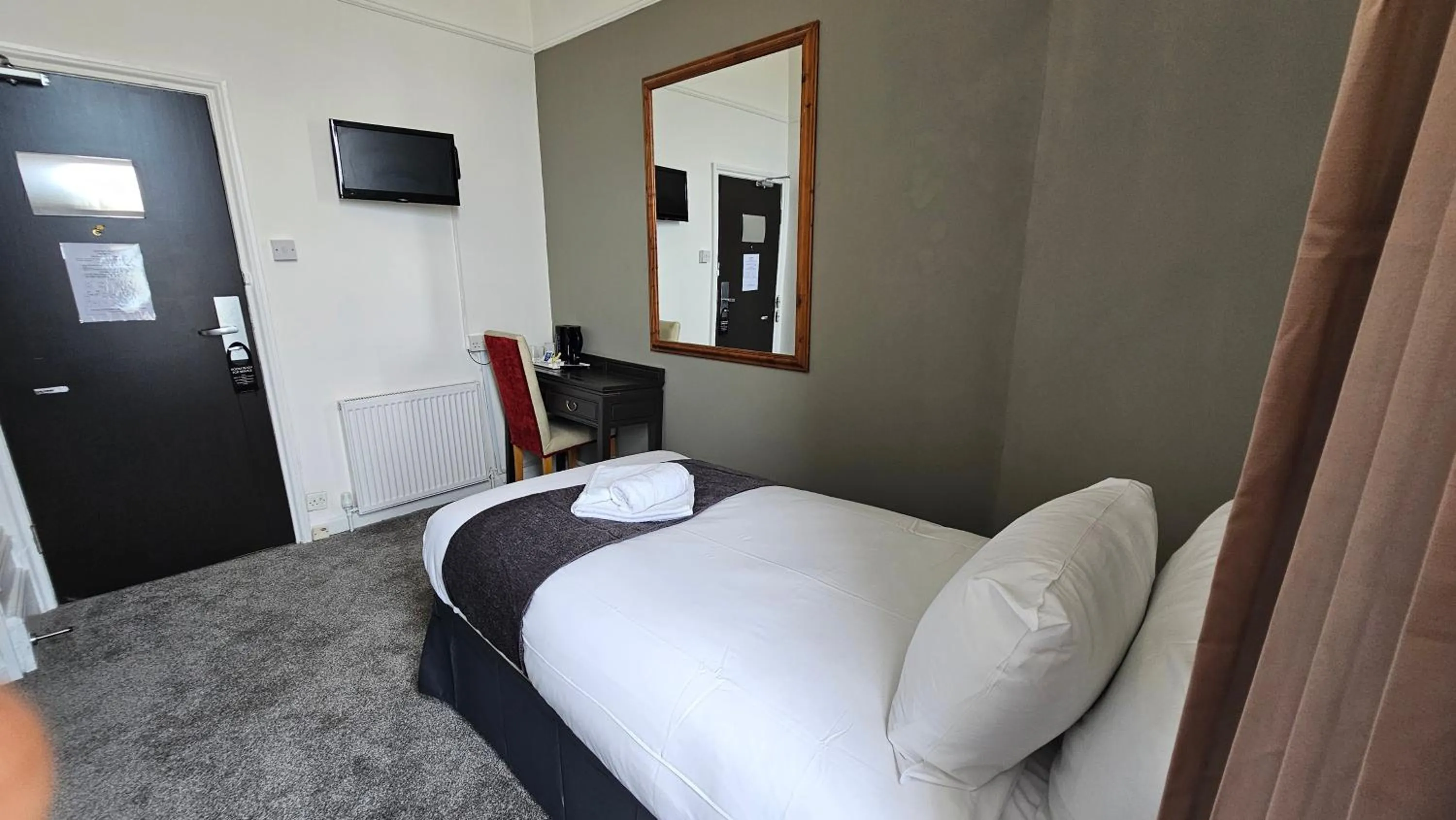 Bed in The Strand Hotel