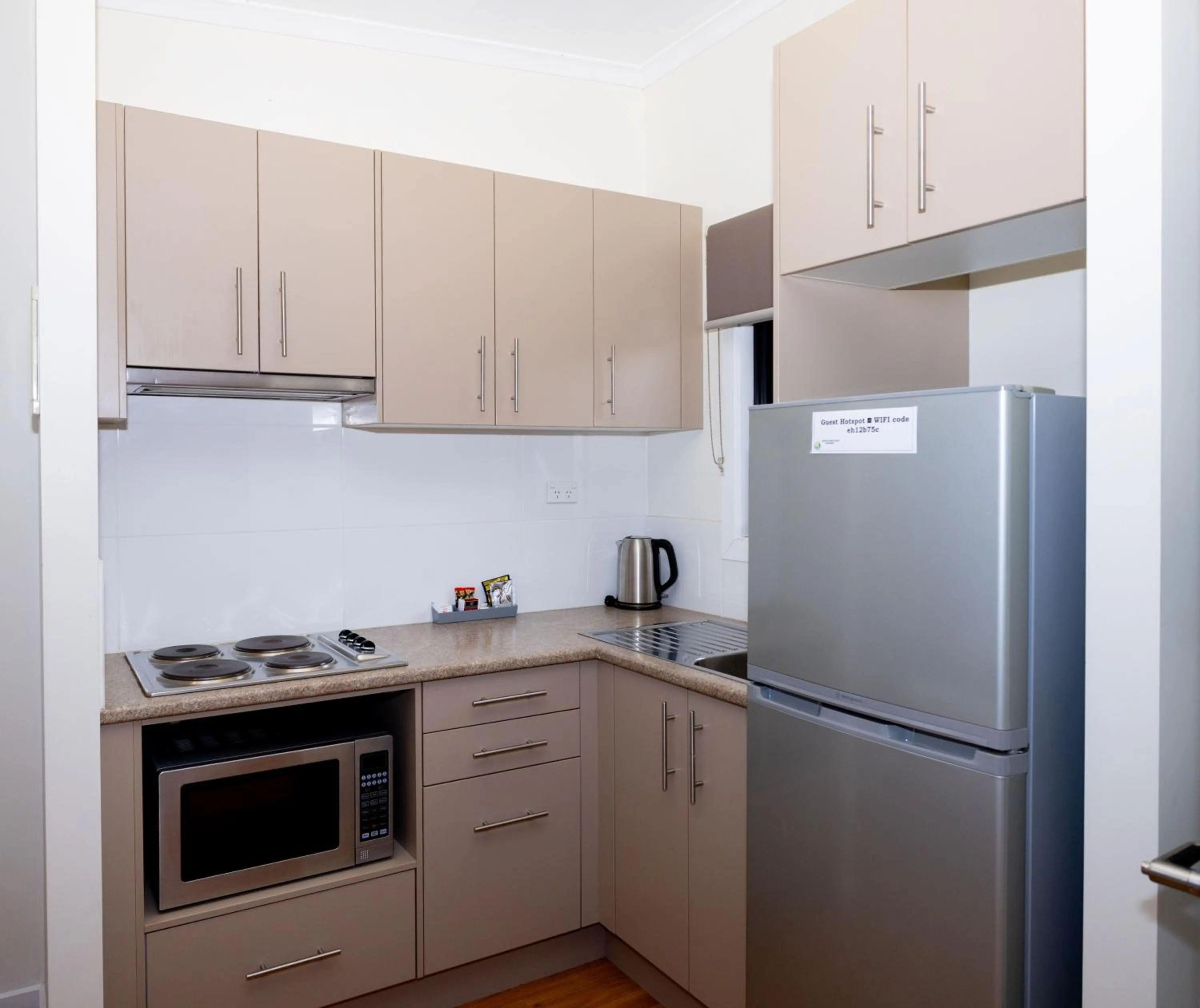 Kitchen or kitchenette in Airport Tourist Village Melbourne