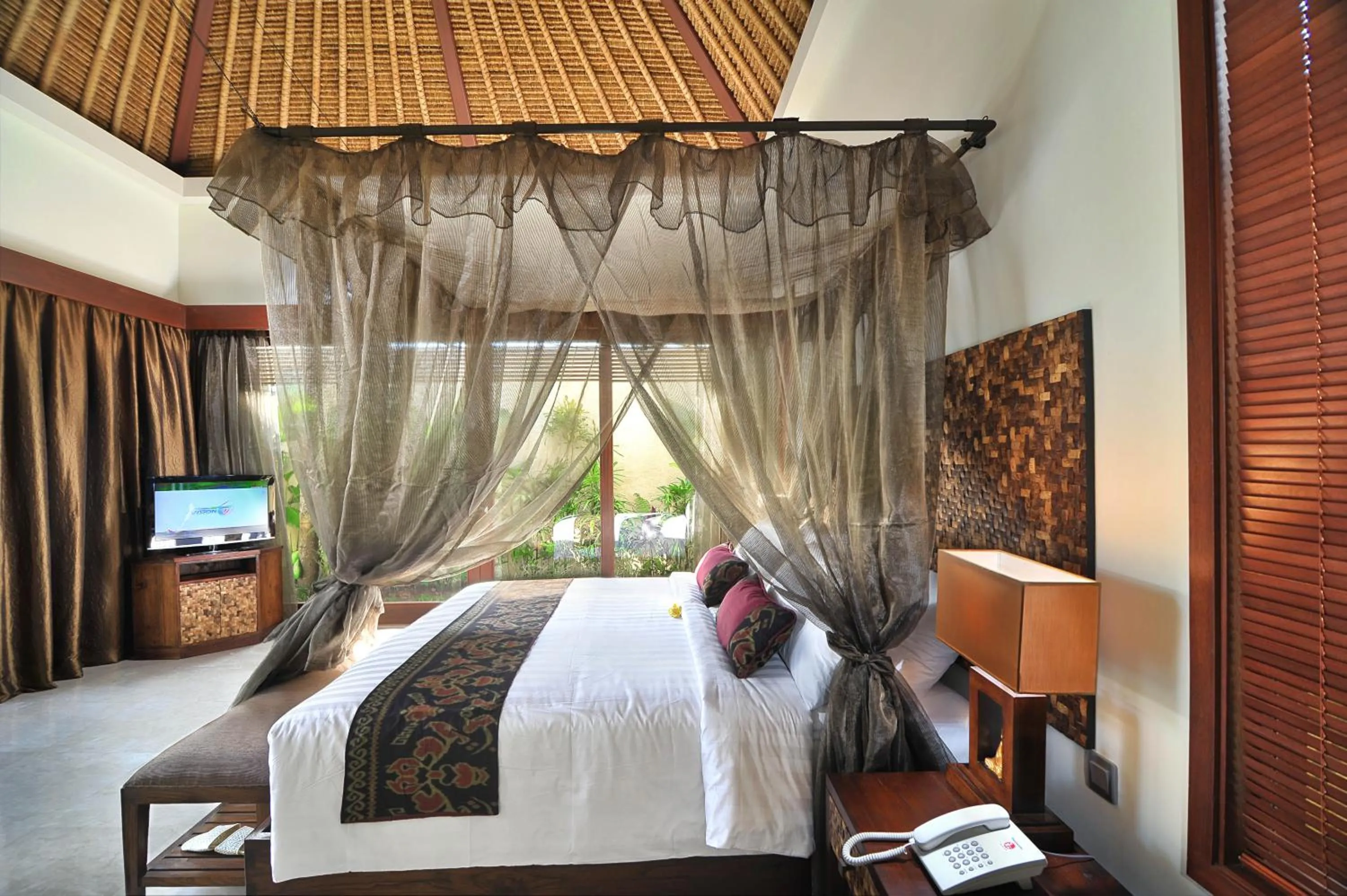 Bed in Mahagiri Villas & Spa Dreamland