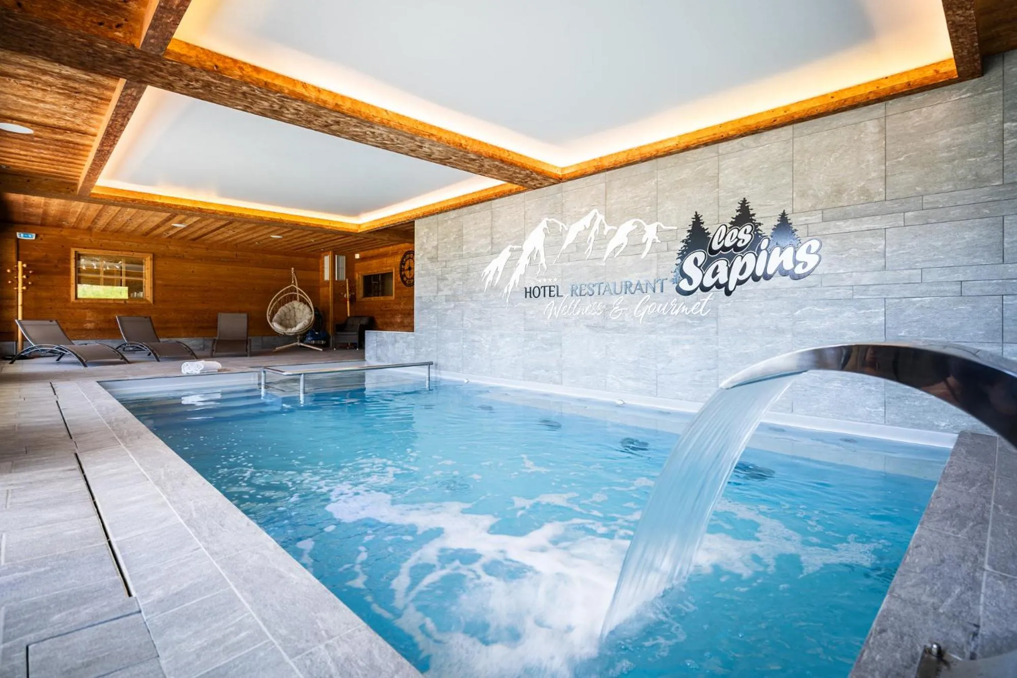 Swimming pool in Hôtel Restaurant "Les Sapins" Wellness & Gourmet