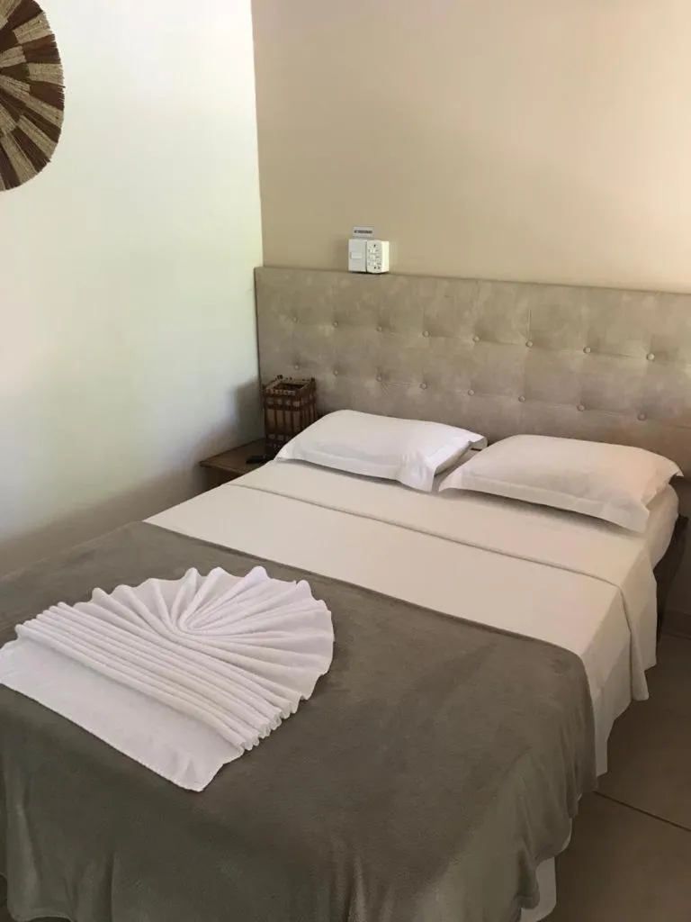 Bed in Pousada Tropical