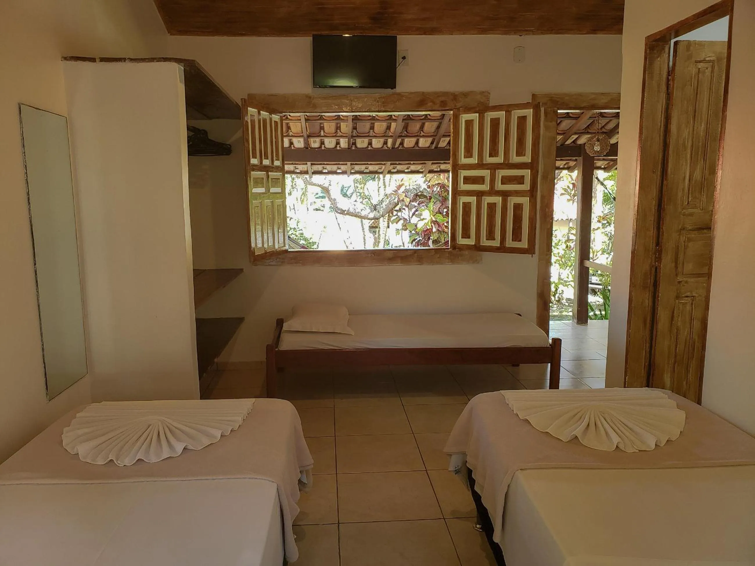 Bed in Pousada Tropical