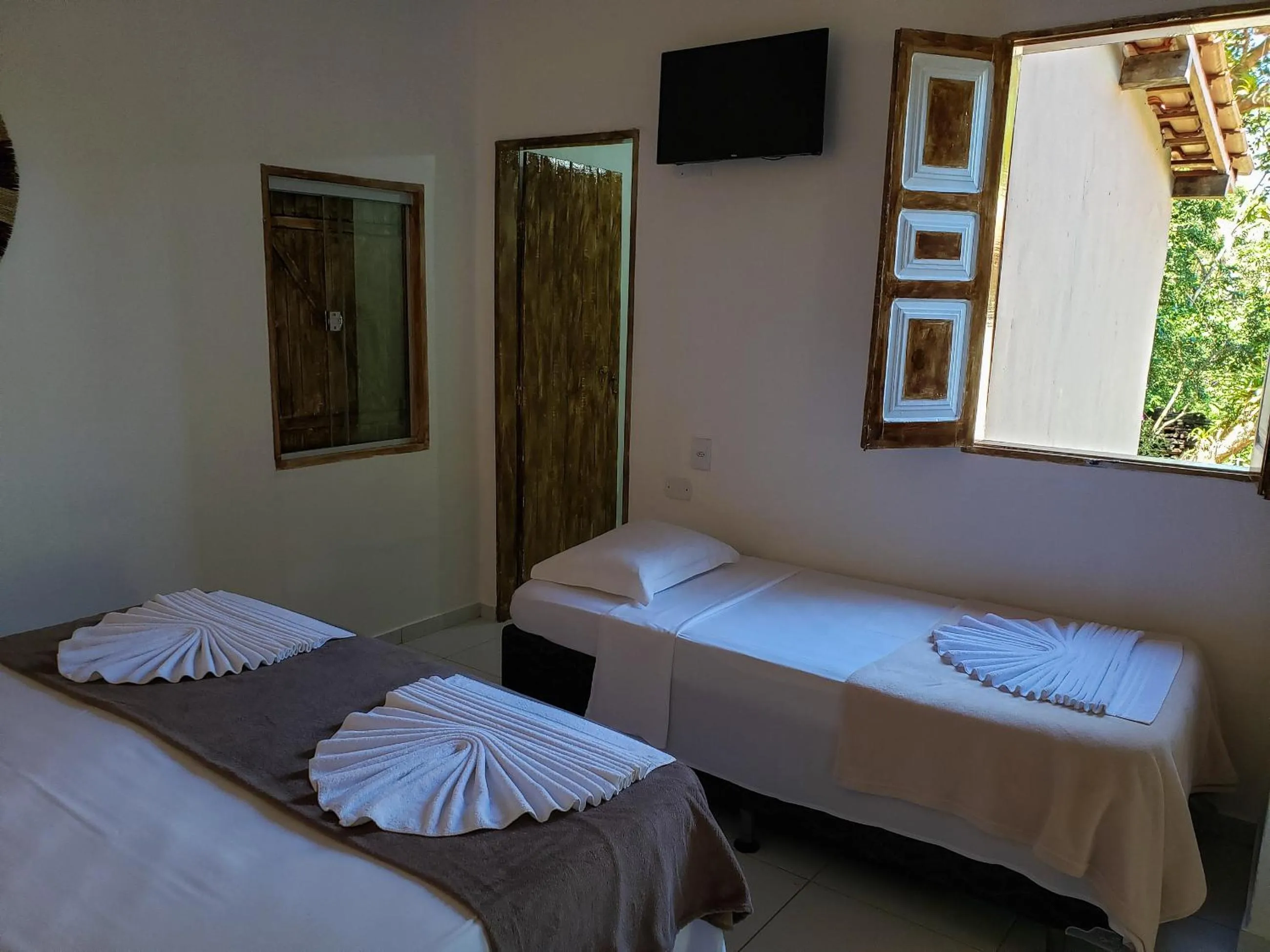 Bed in Pousada Tropical