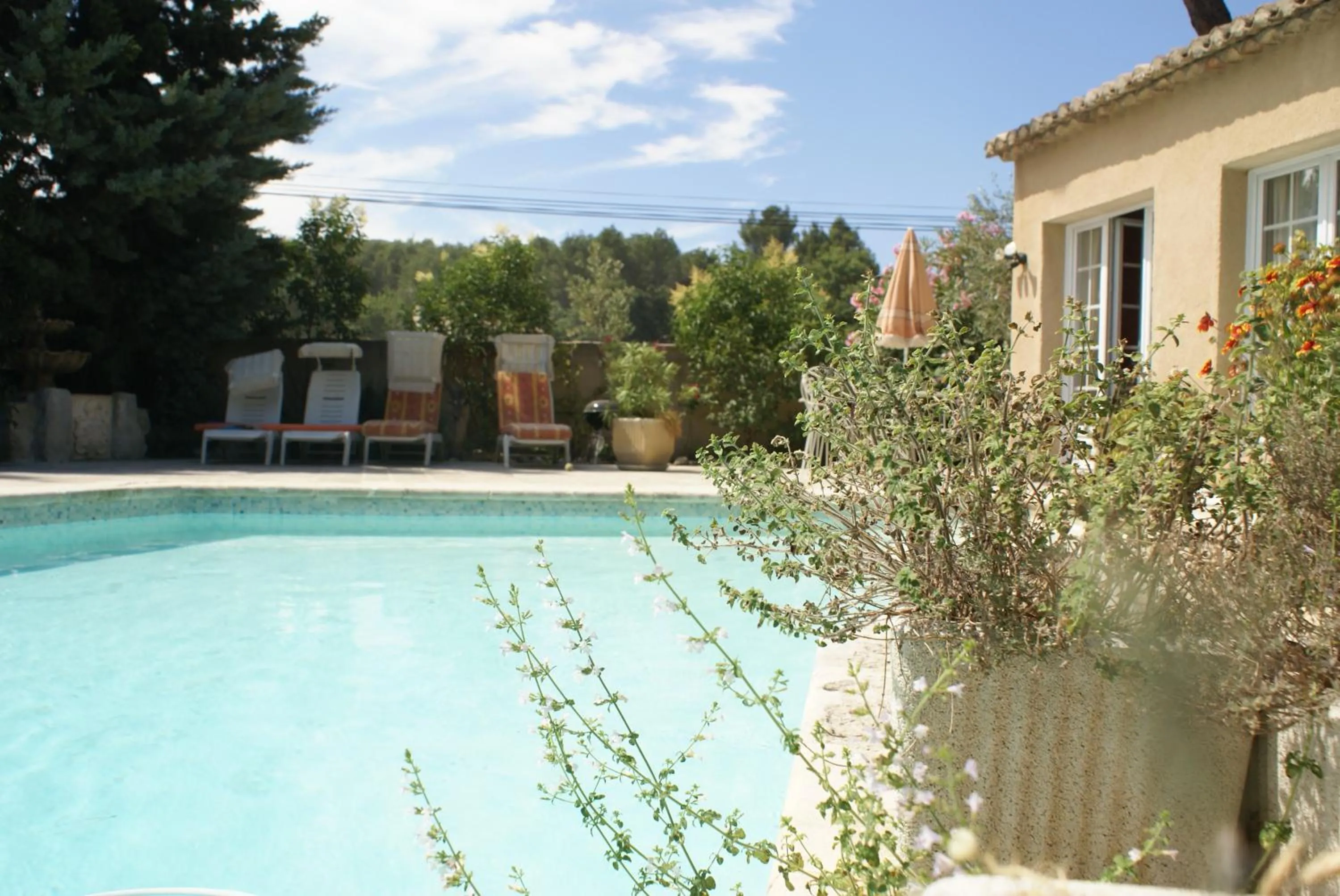 Swimming pool in Gites Climatisés Piscine Chauffée La Balancelle