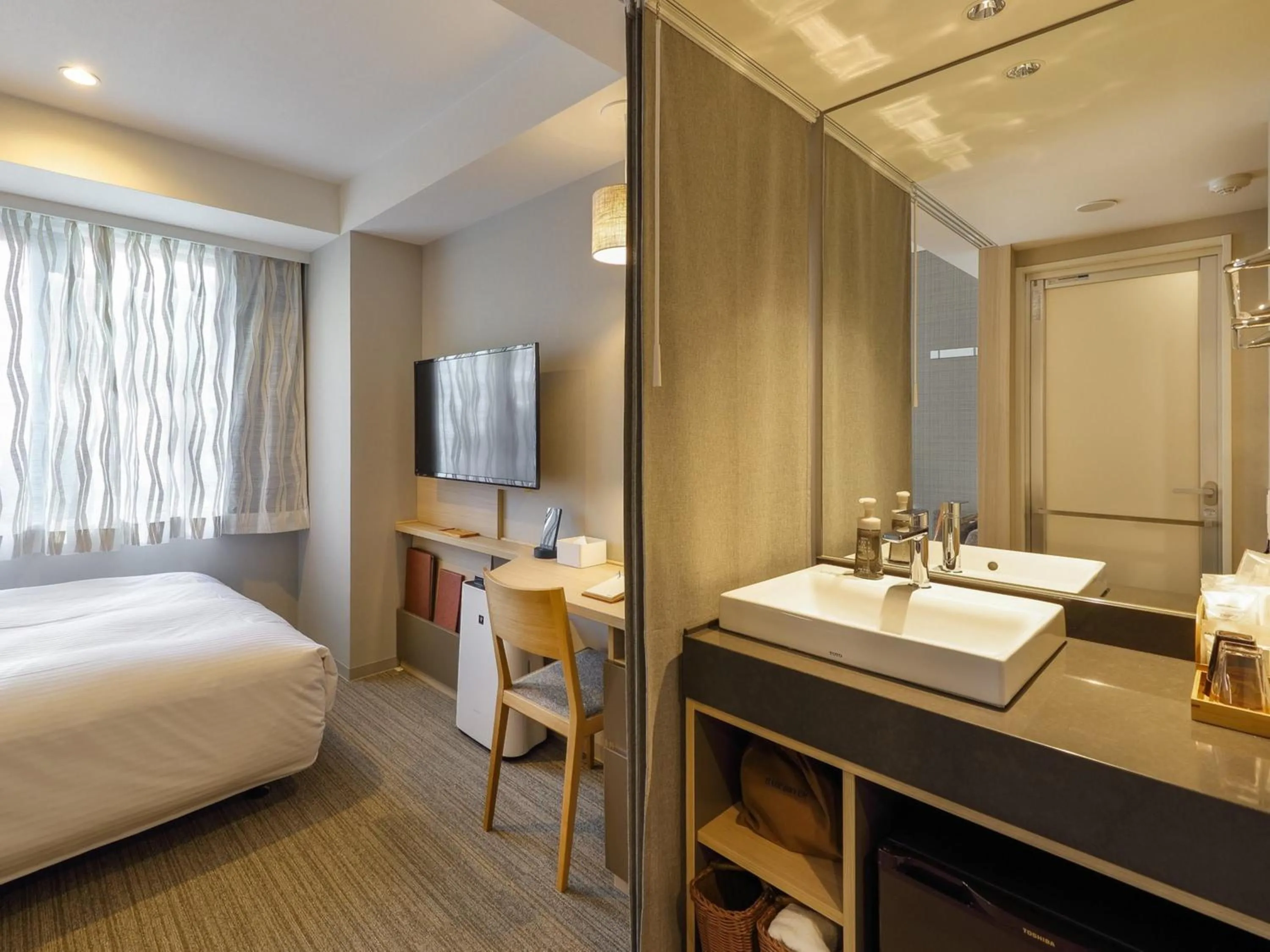 Photo of the whole room, Bed in Nishitetsu Hotel Croom Nagoya