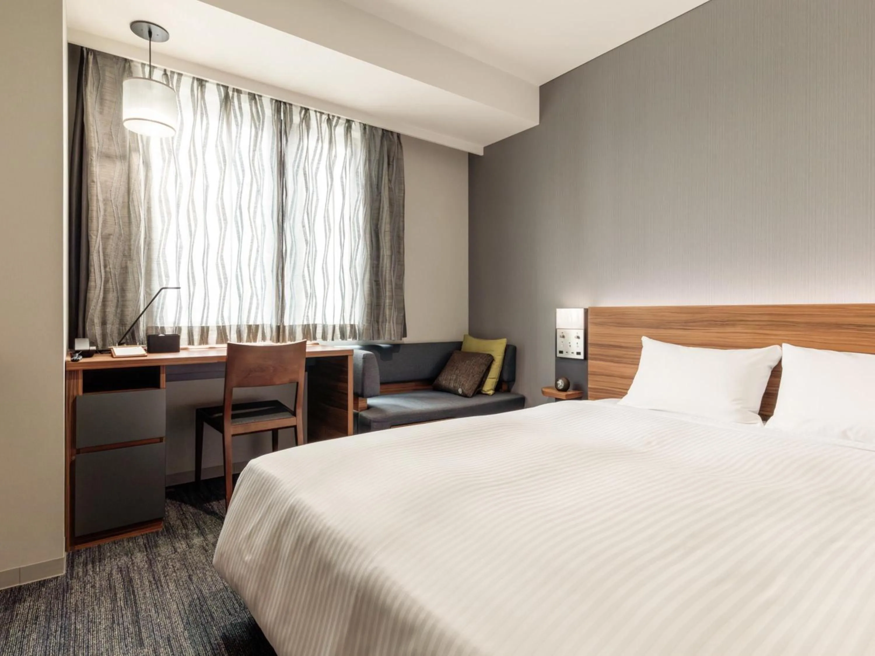 Photo of the whole room, Bed in Nishitetsu Hotel Croom Nagoya