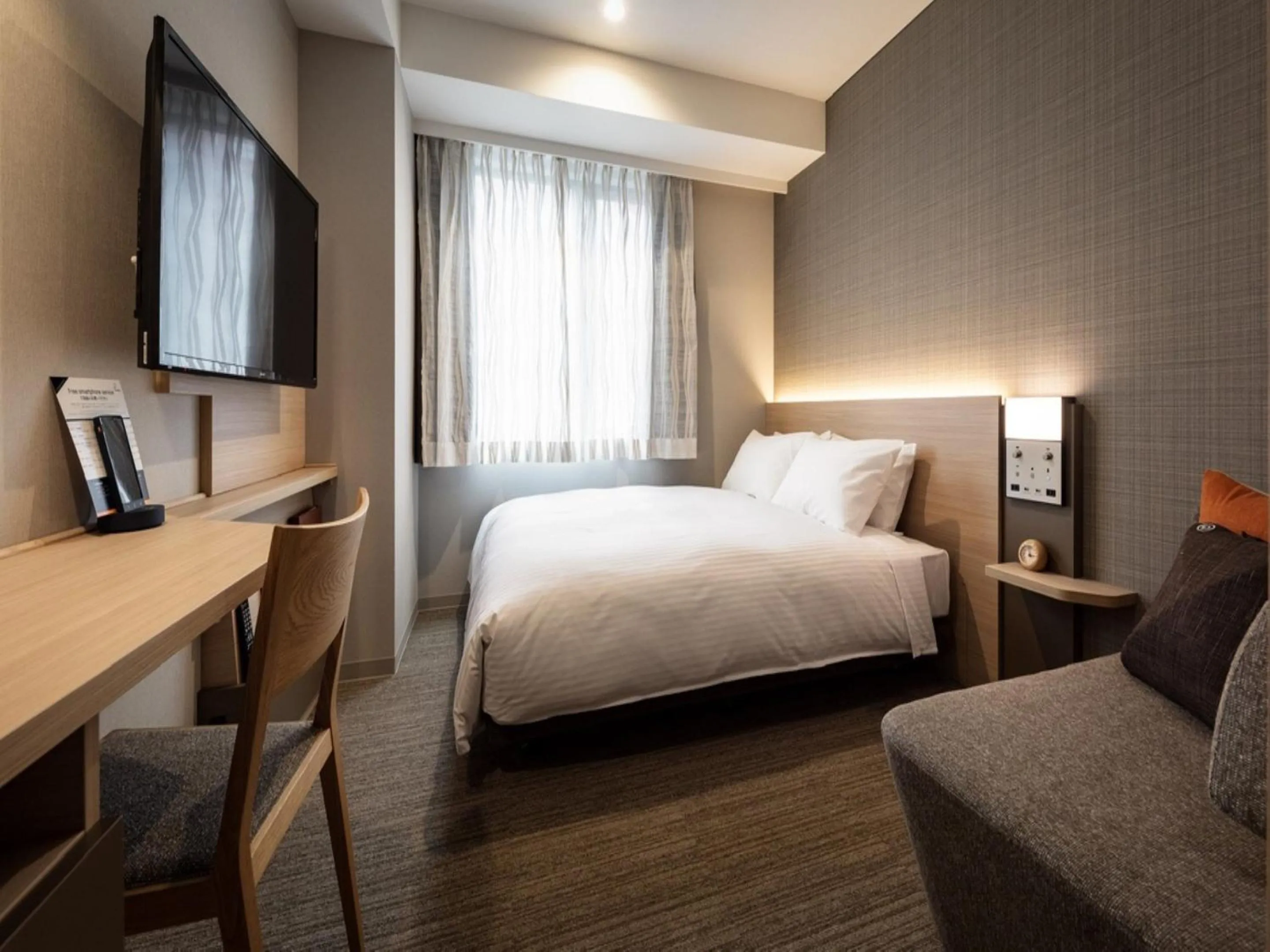 Photo of the whole room, Bed in Nishitetsu Hotel Croom Nagoya