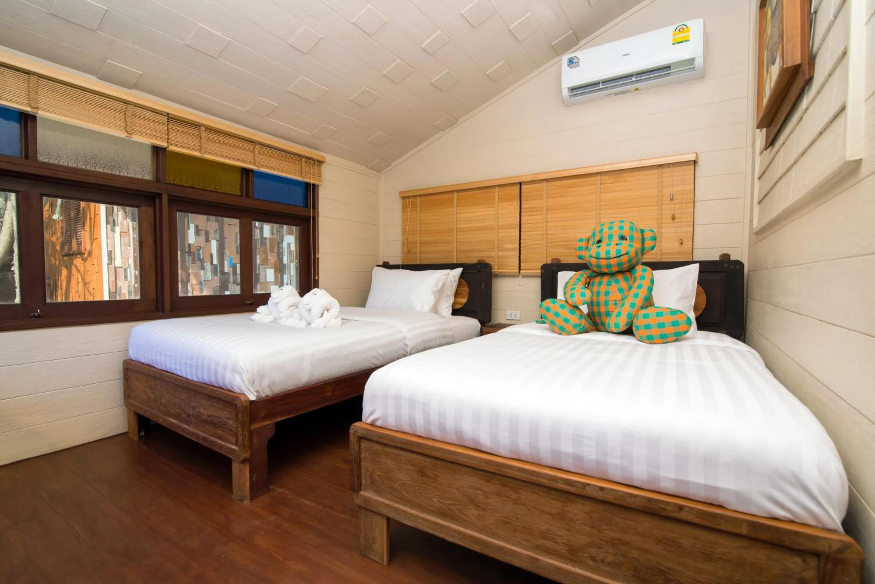 Bed in Suankaew Art Cottage