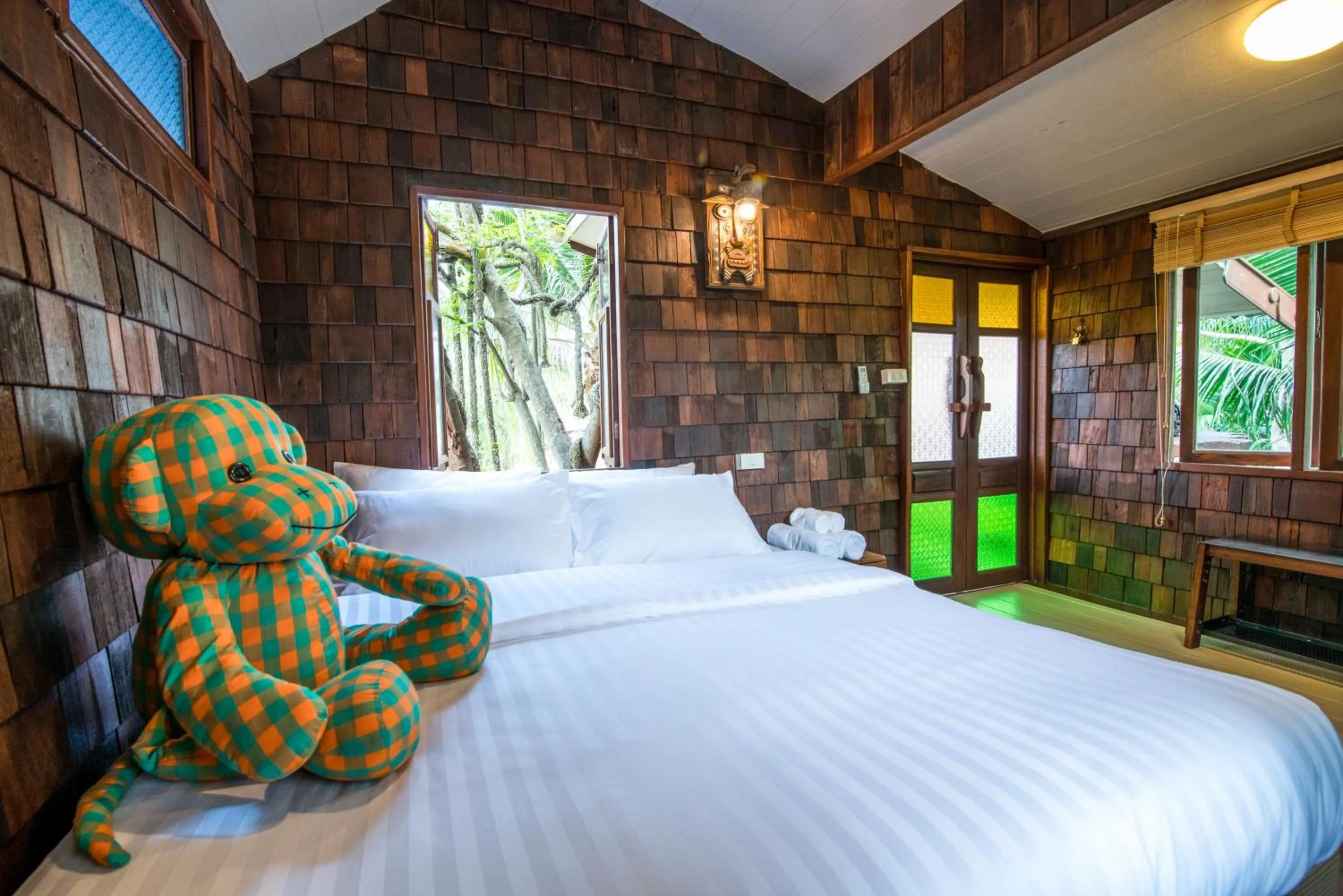 Bed in Suankaew Art Cottage