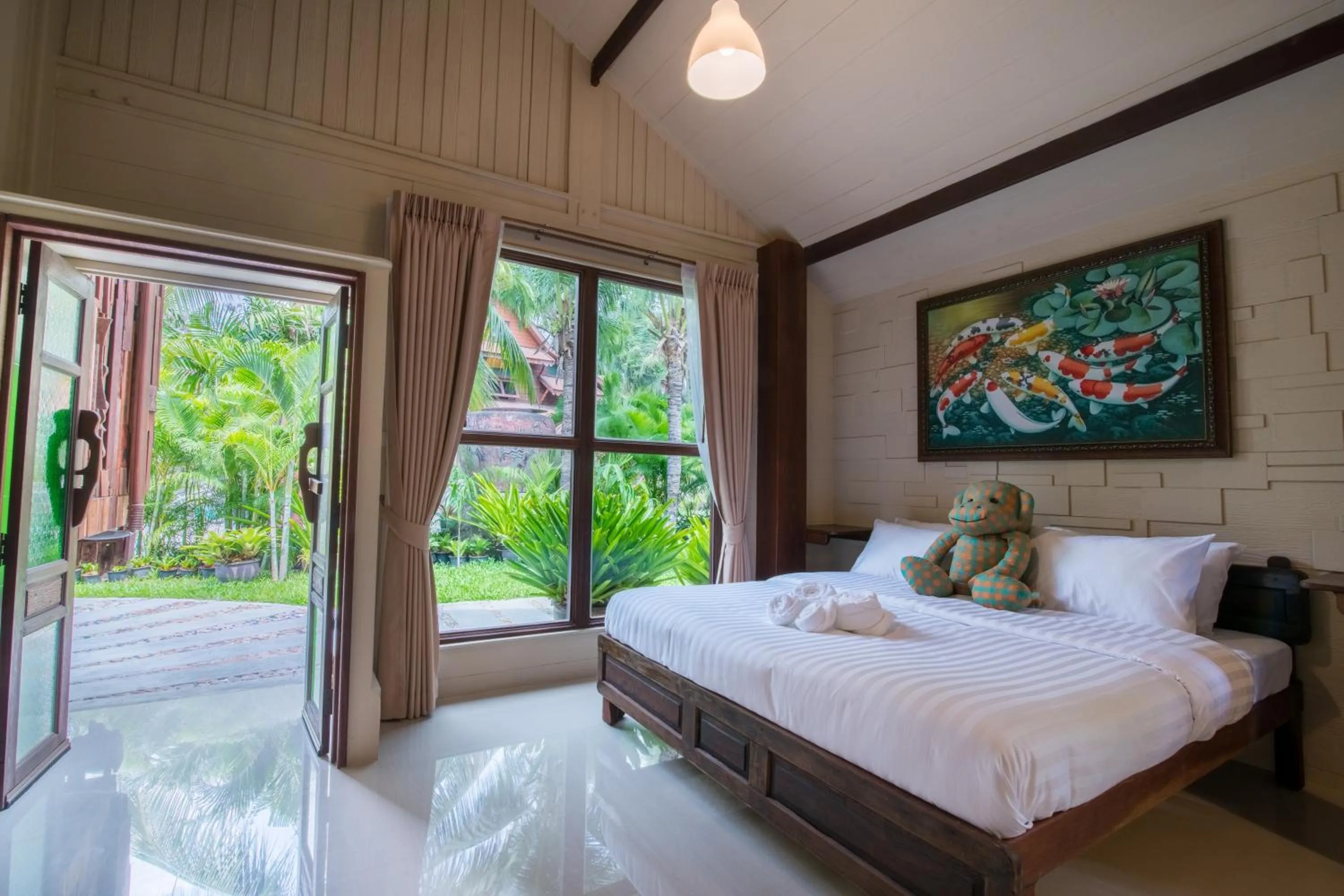 Bed in Suankaew Art Cottage