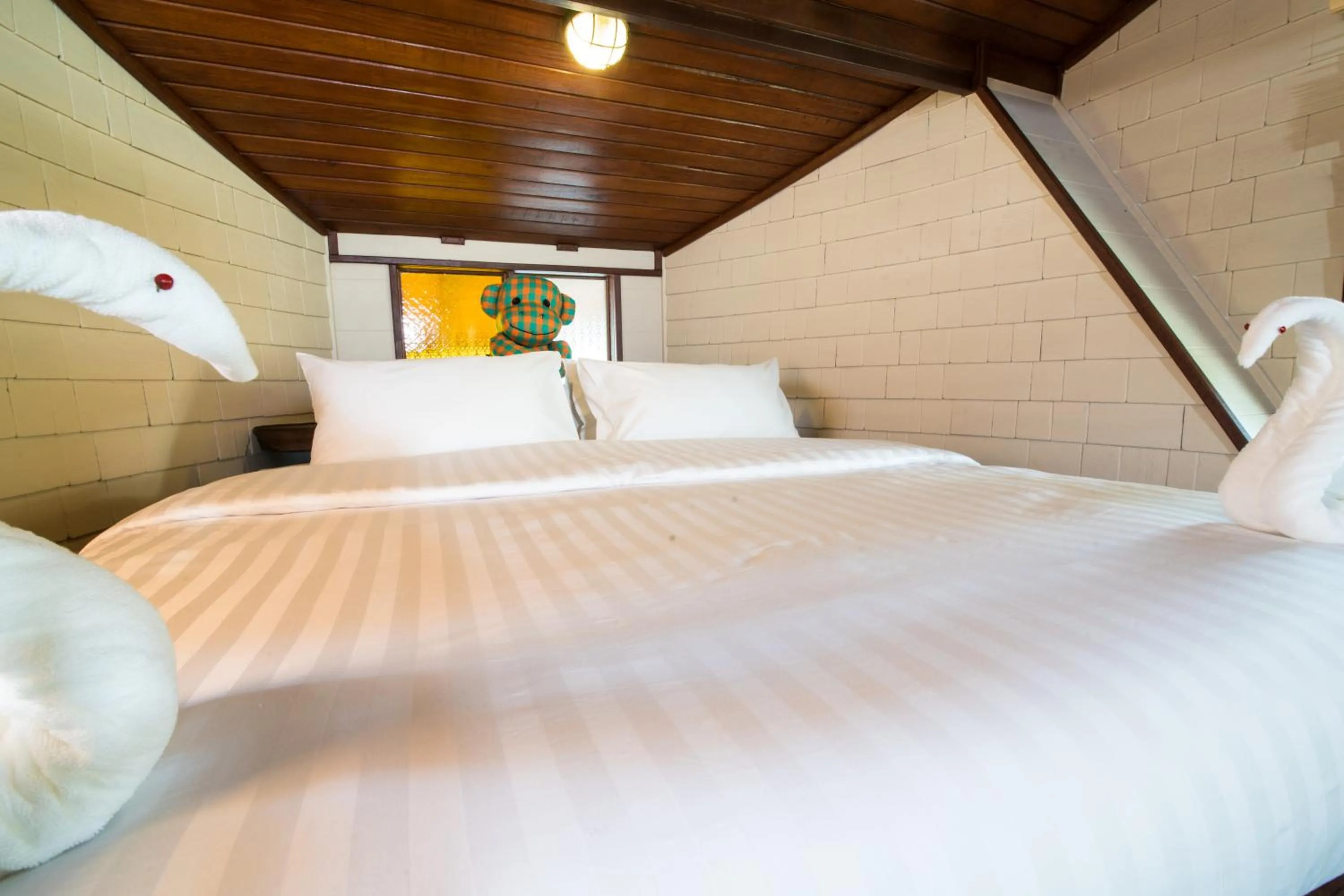 Bed in Suankaew Art Cottage