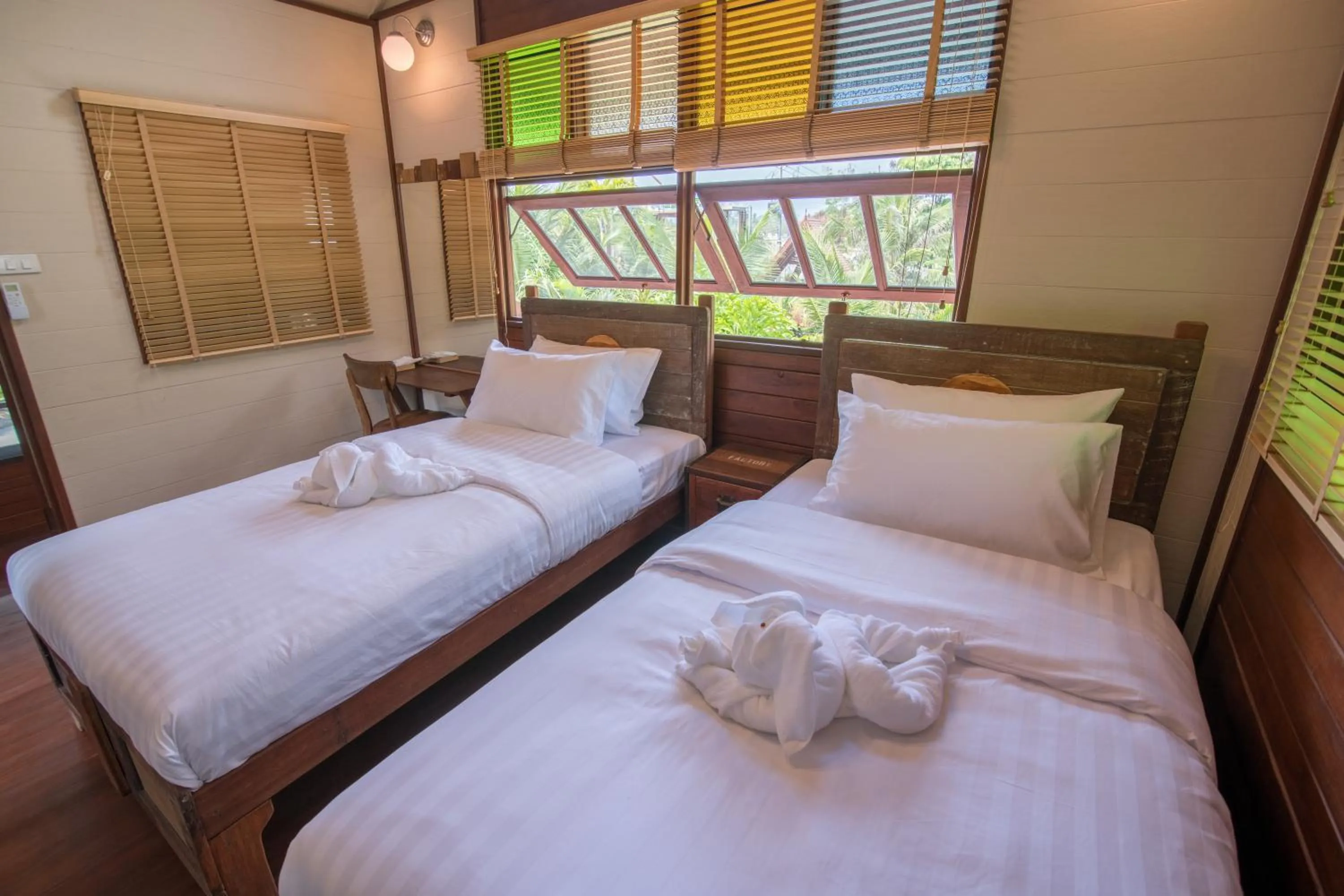Bed in Suankaew Art Cottage