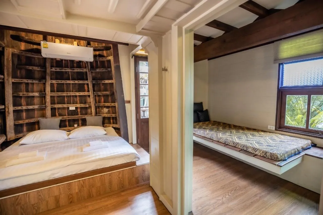 Bed in Suankaew Art Cottage