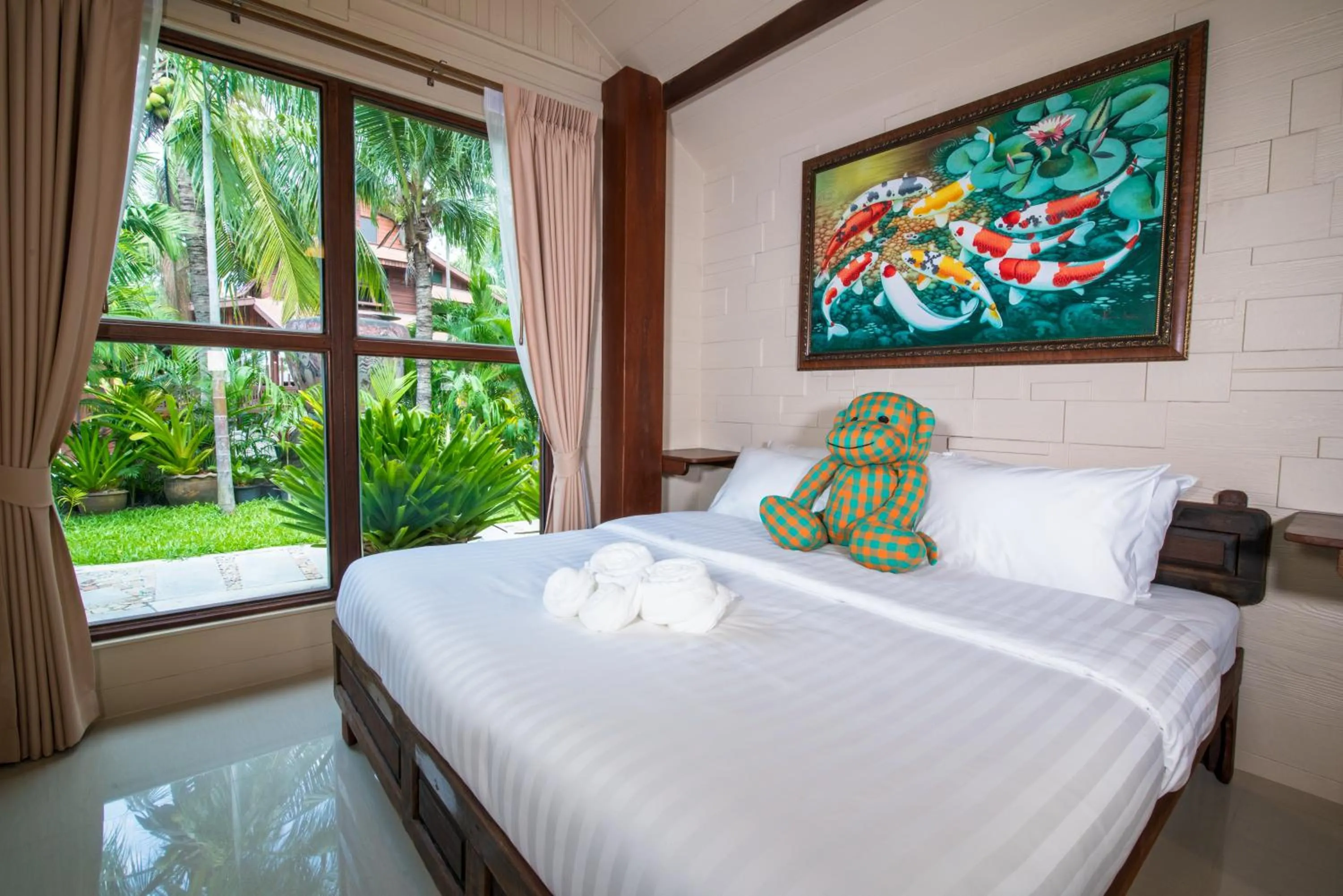 Bed in Suankaew Art Cottage