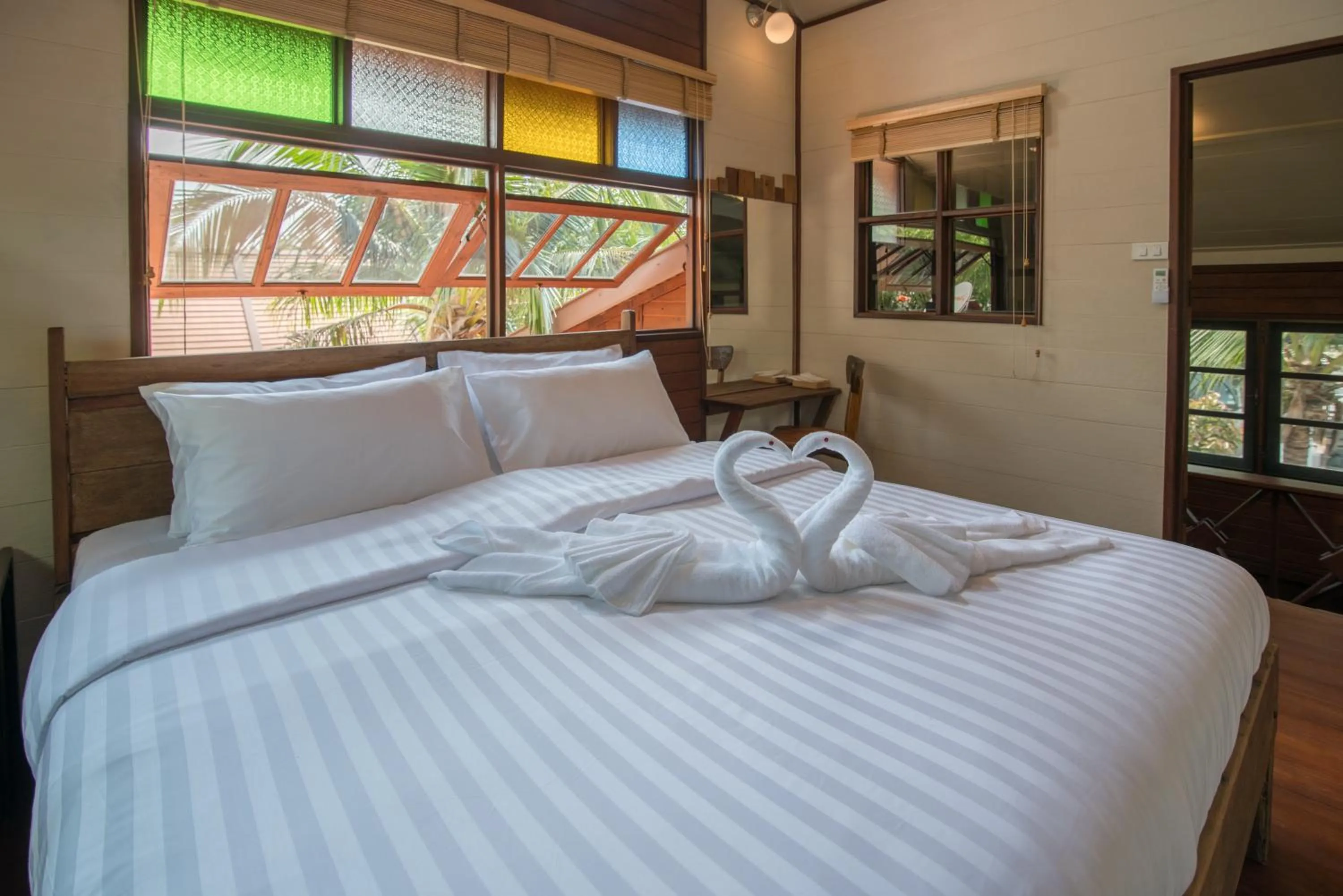 Bed in Suankaew Art Cottage