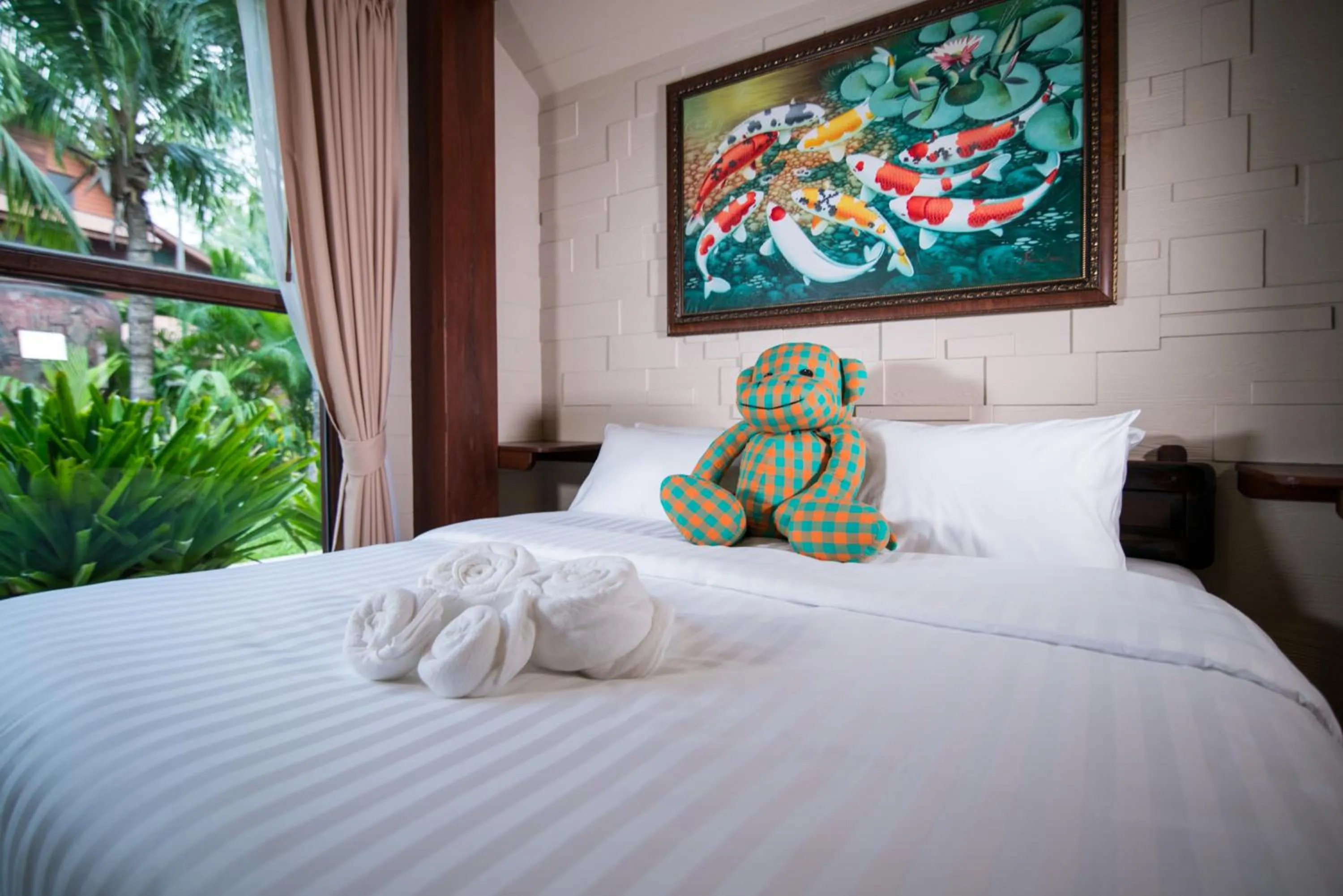 Bed in Suankaew Art Cottage