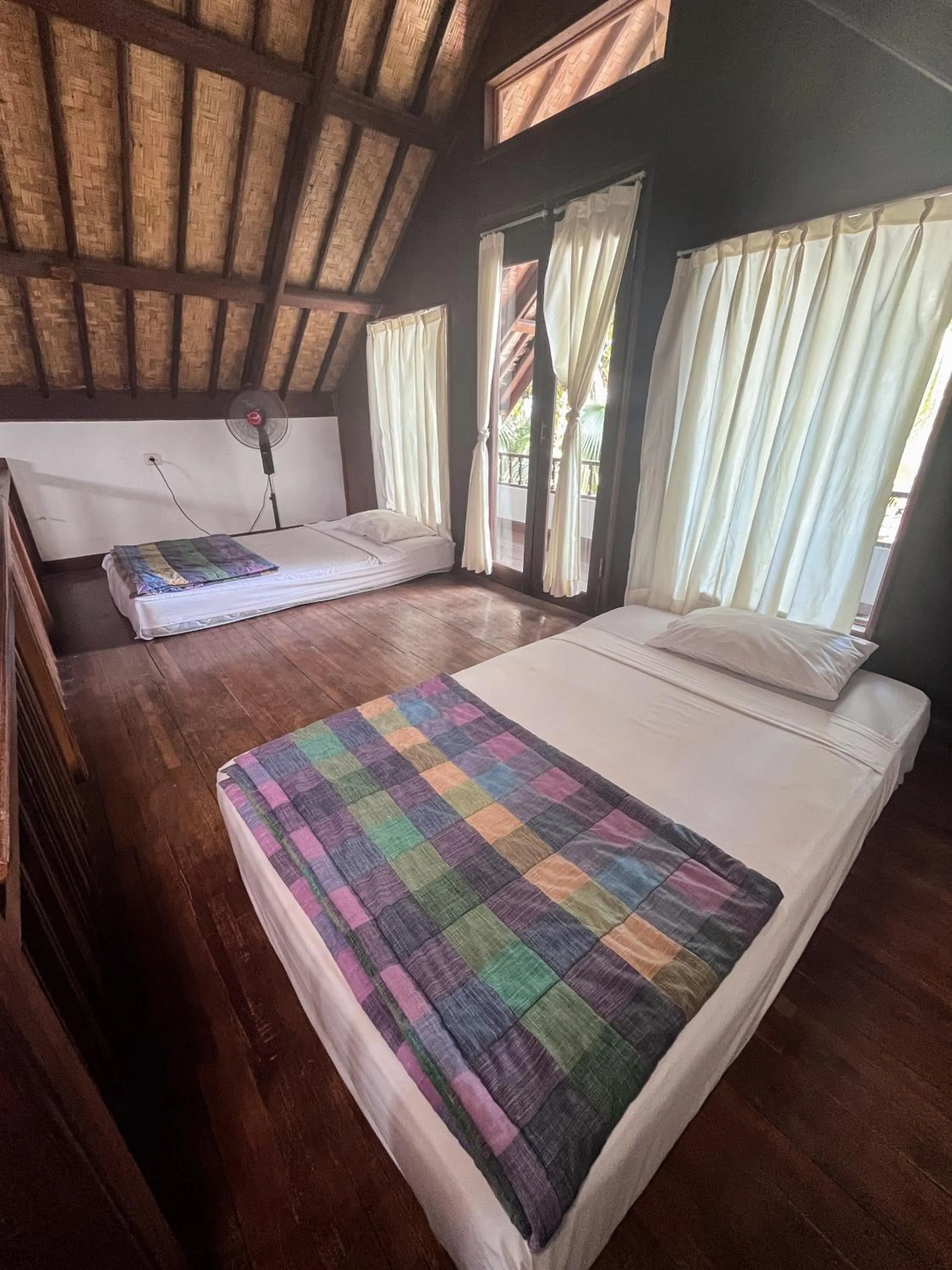 Bed in Apa Kabar Villas