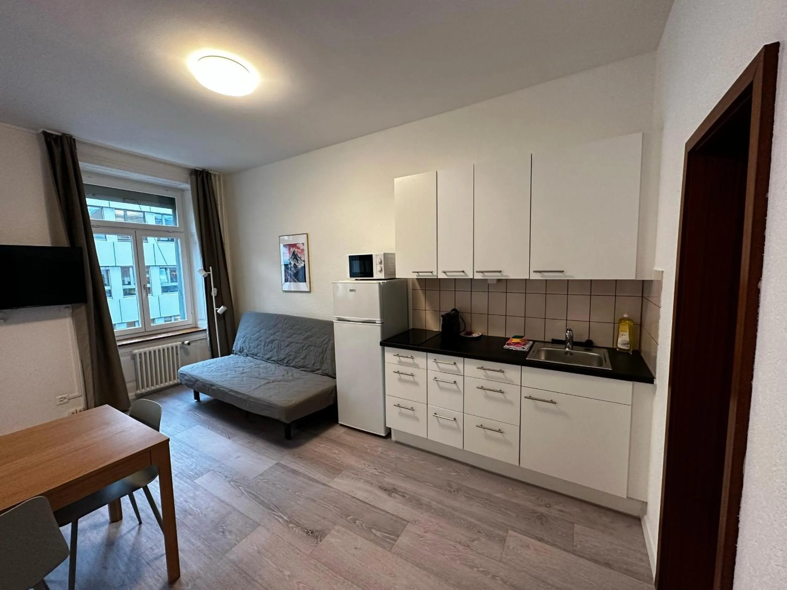 Kitchen or kitchenette in HITrental Seefeld - Kreuzstrasse Apartments