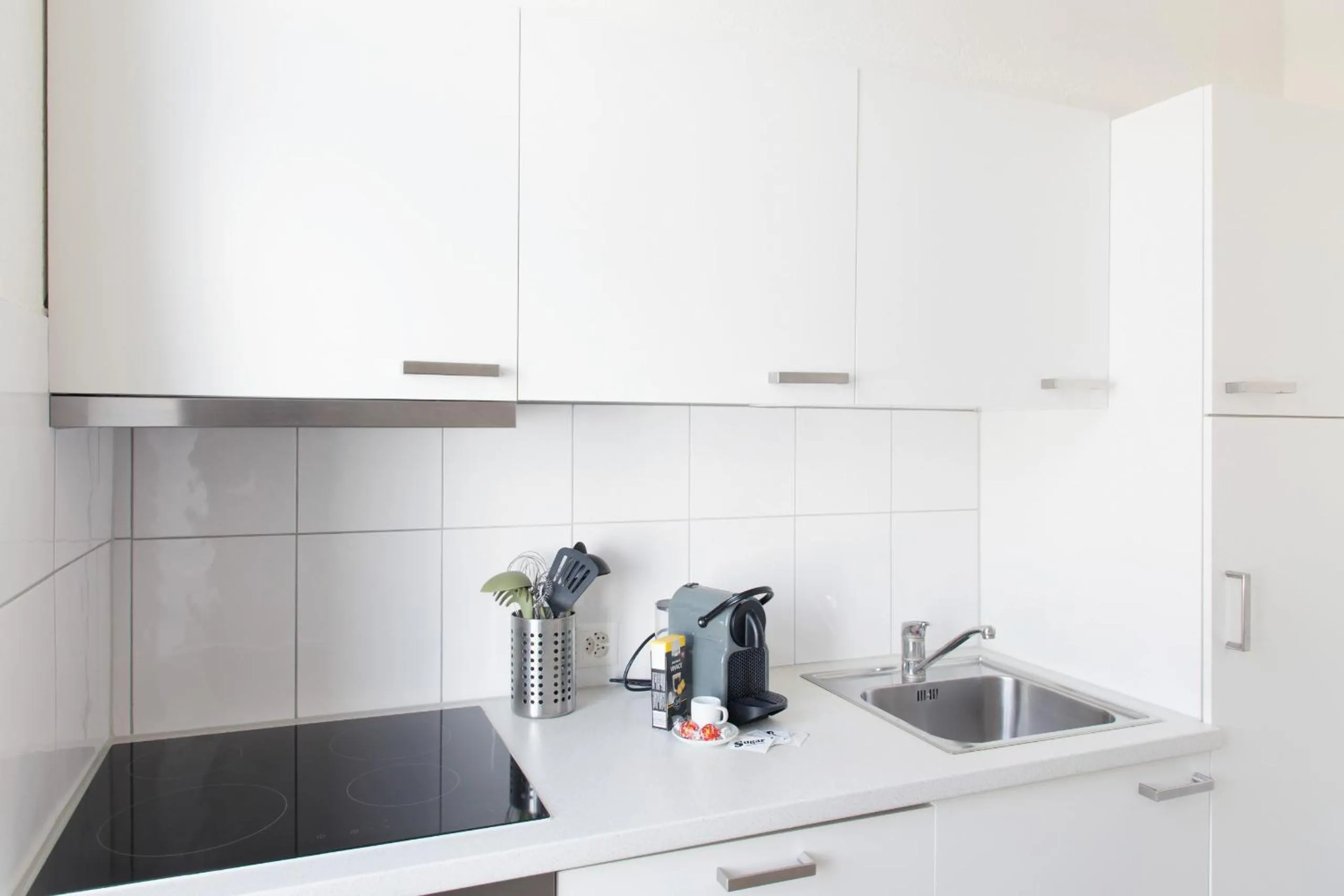 Kitchen or kitchenette in HITrental Seefeld - Kreuzstrasse Apartments
