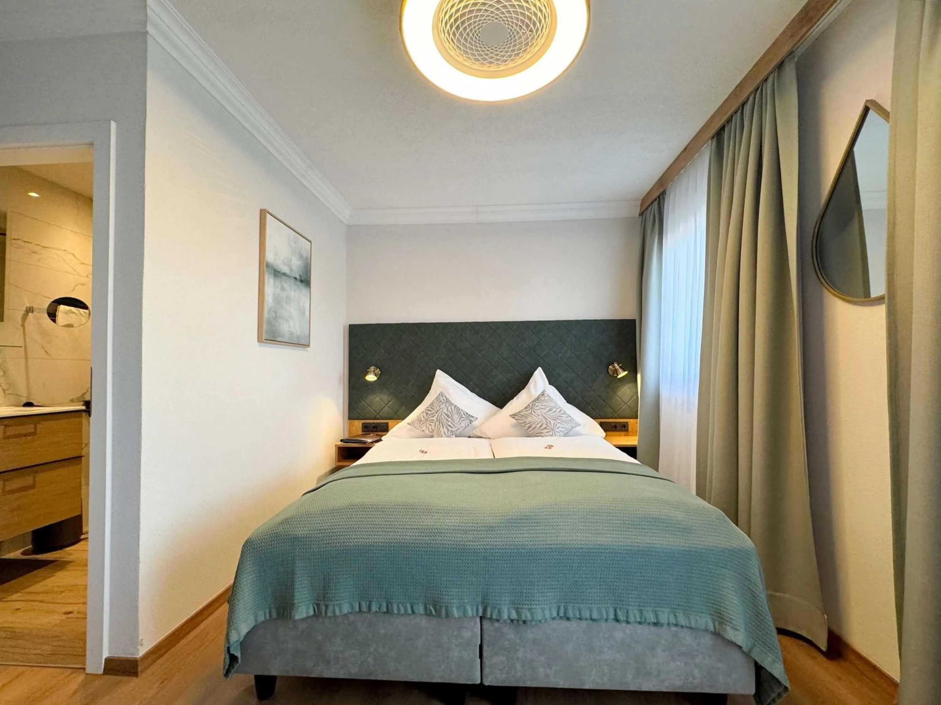 Photo of the whole room, Bed in Hotel Schlossblick Chiemsee