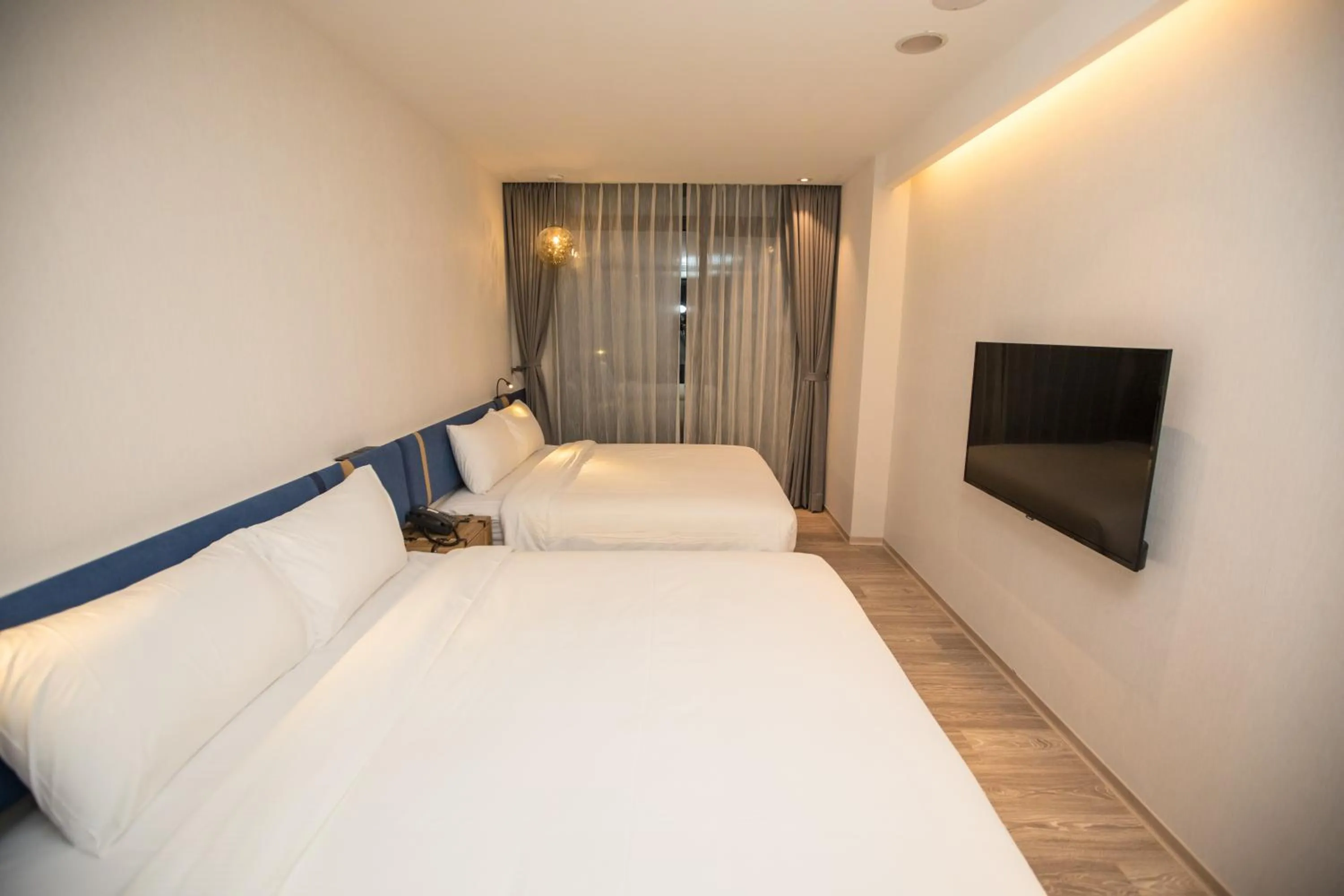 Bed in Explore Hotel