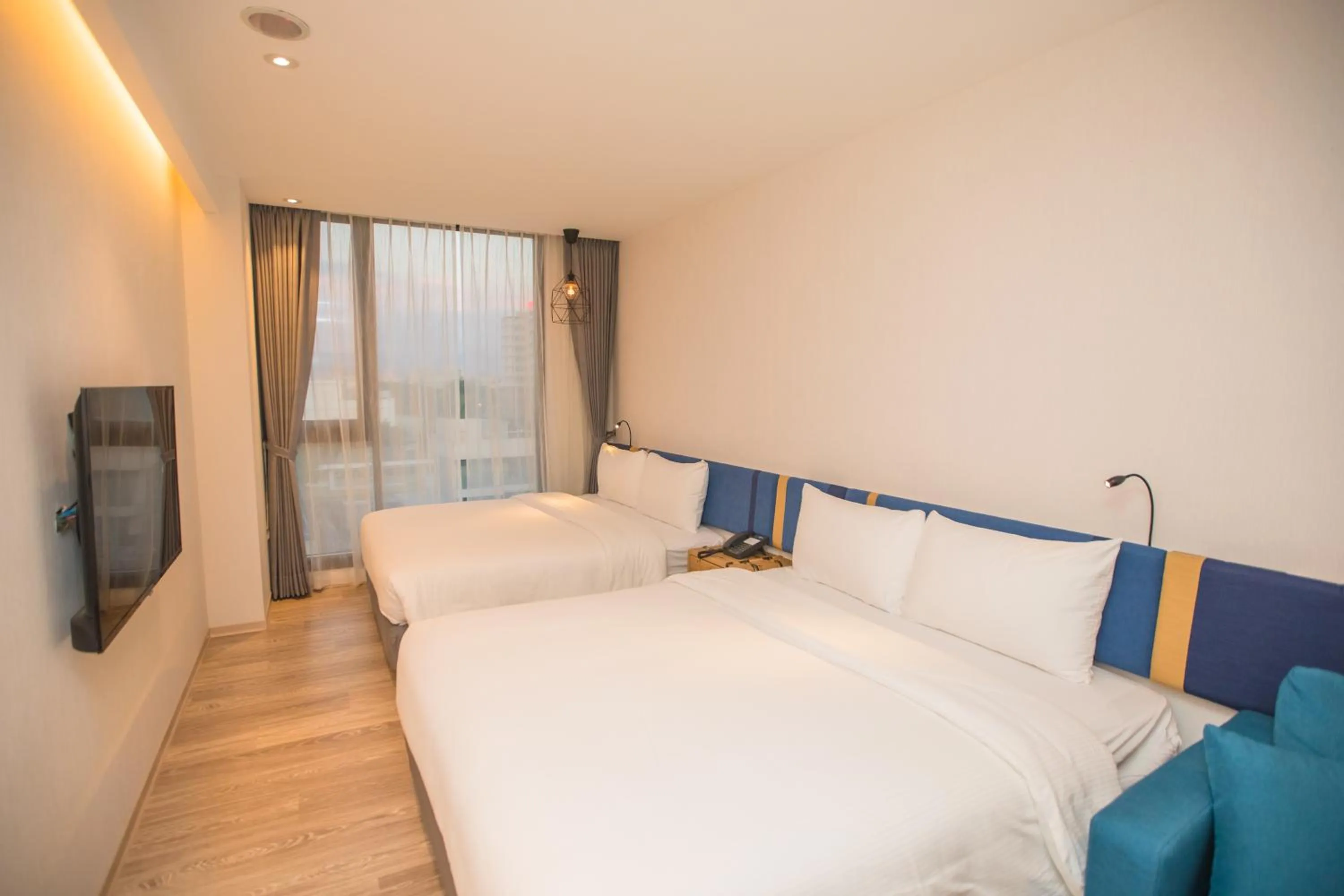 Bed in Explore Hotel