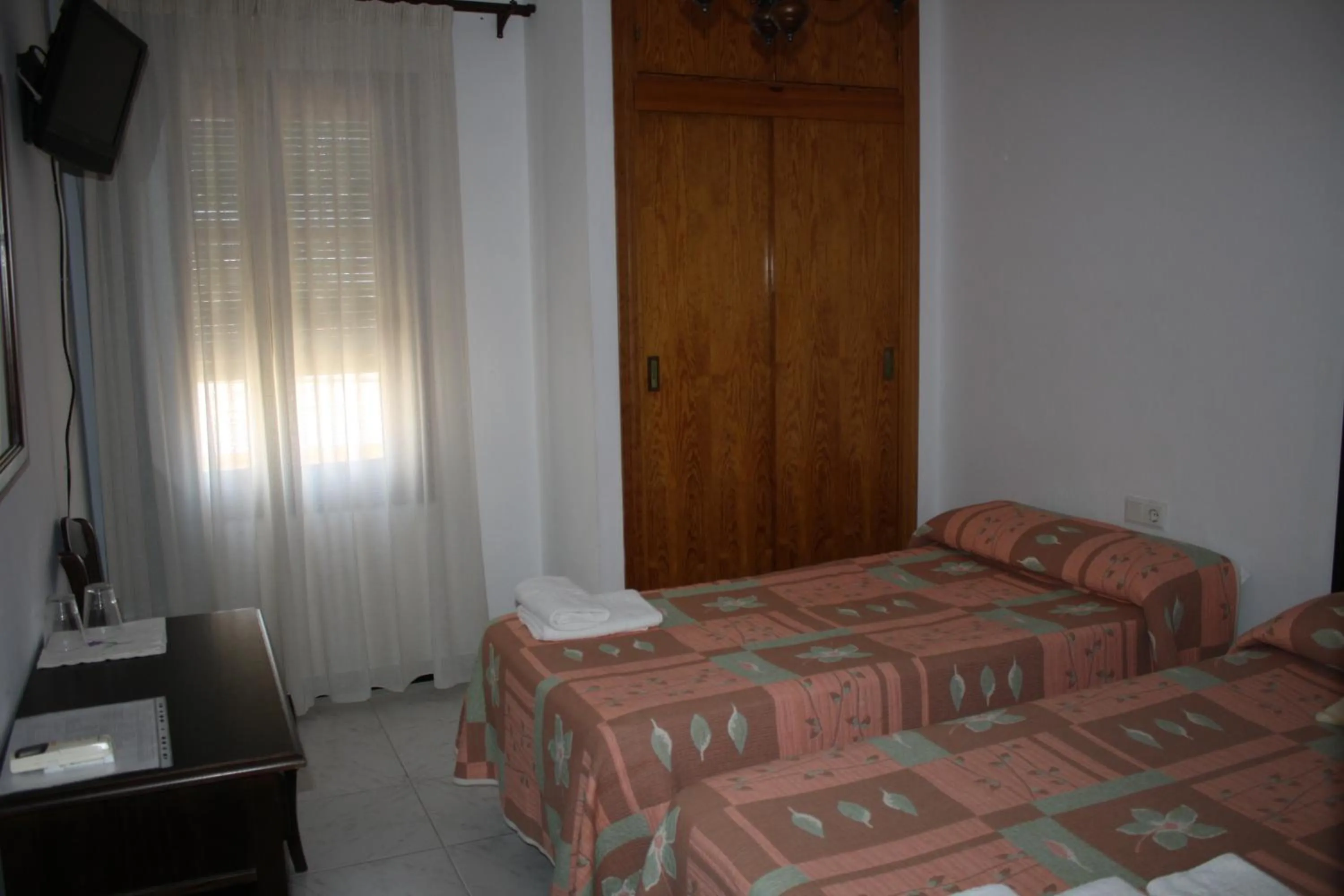 Photo of the whole room, Bed in Hostal Torre de Guzmán