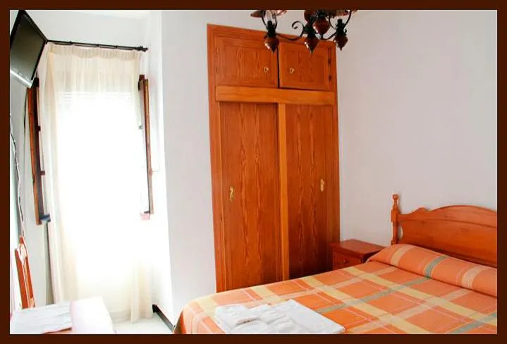 Photo of the whole room, Bed in Hostal Torre de Guzmán