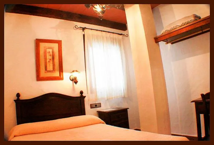 Photo of the whole room, Bed in Hostal Torre de Guzmán