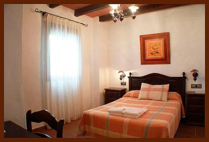 Photo of the whole room, Bed in Hostal Torre de Guzmán